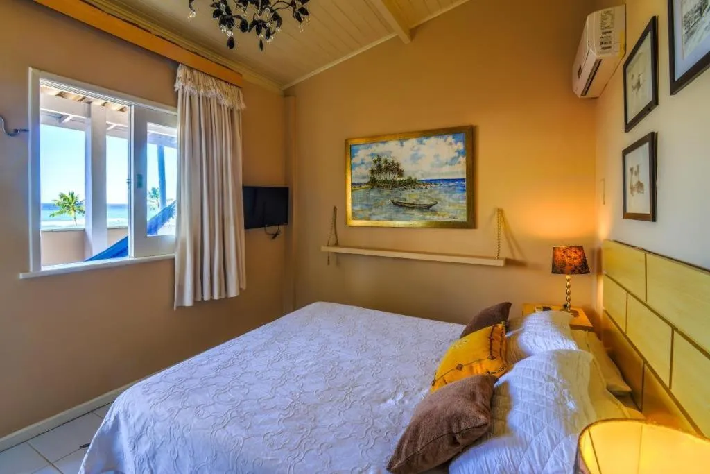 Bed in Pousada Via Brasil