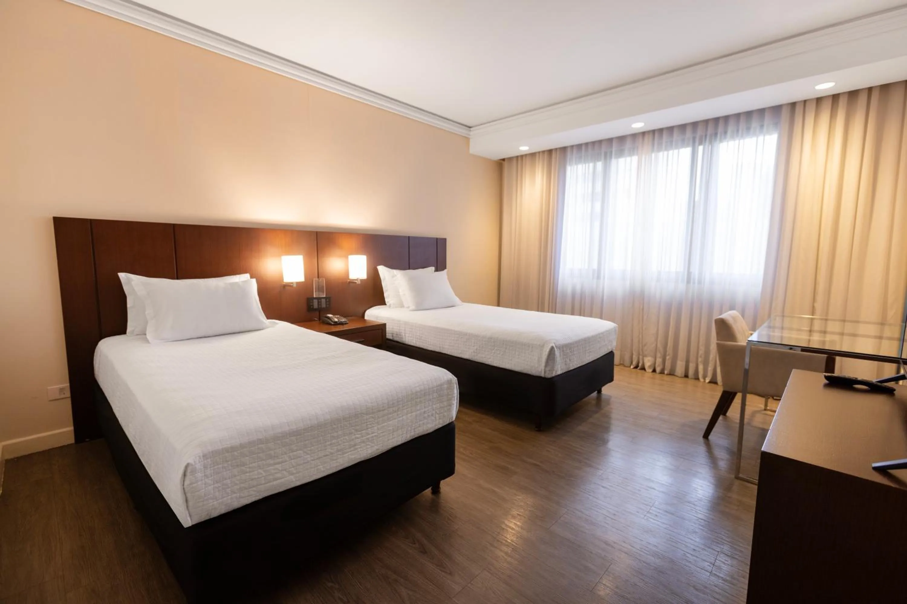 Bed in Grand Mercure Curitiba Rayon