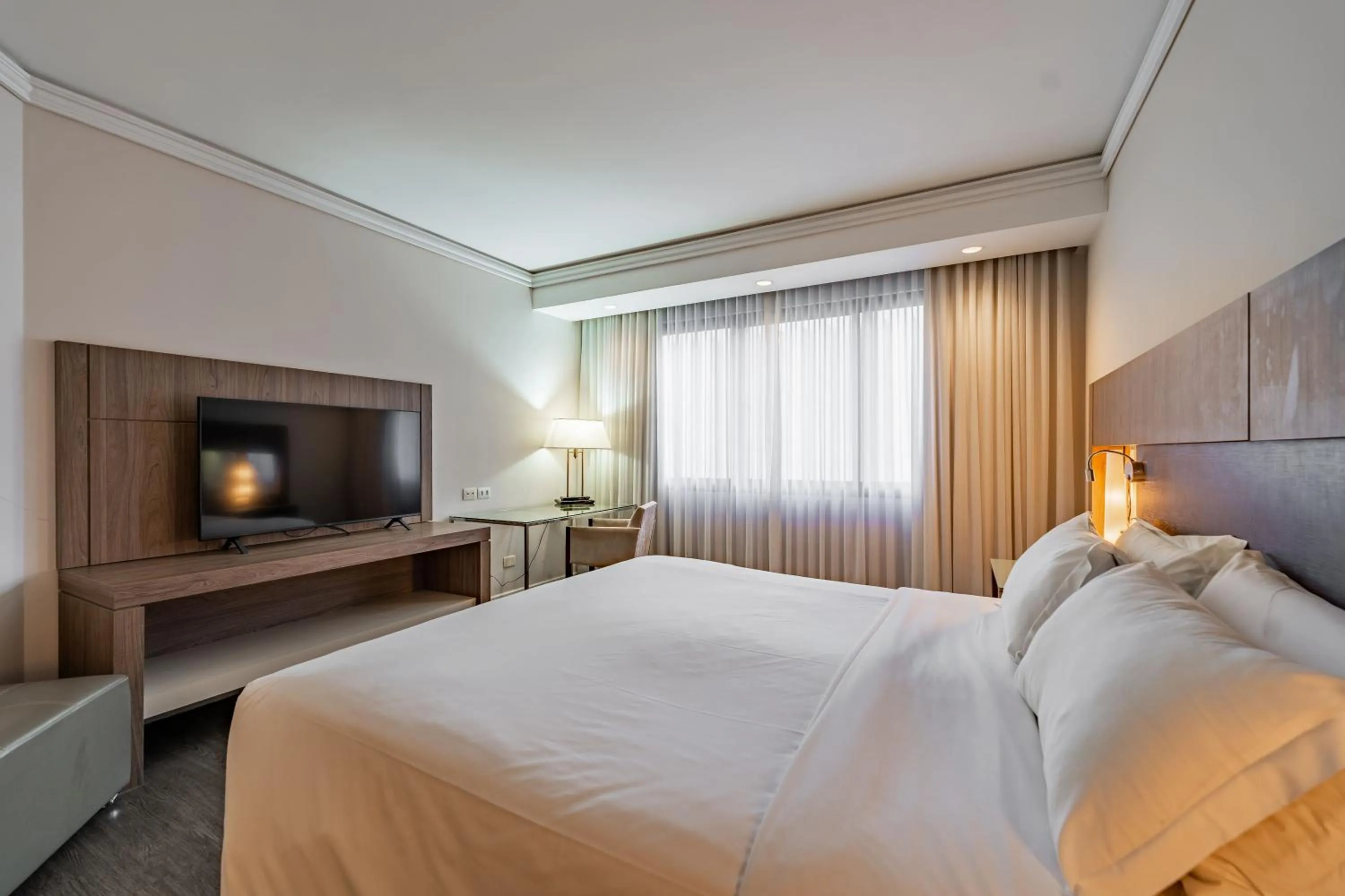 Bed in Grand Mercure Curitiba Rayon