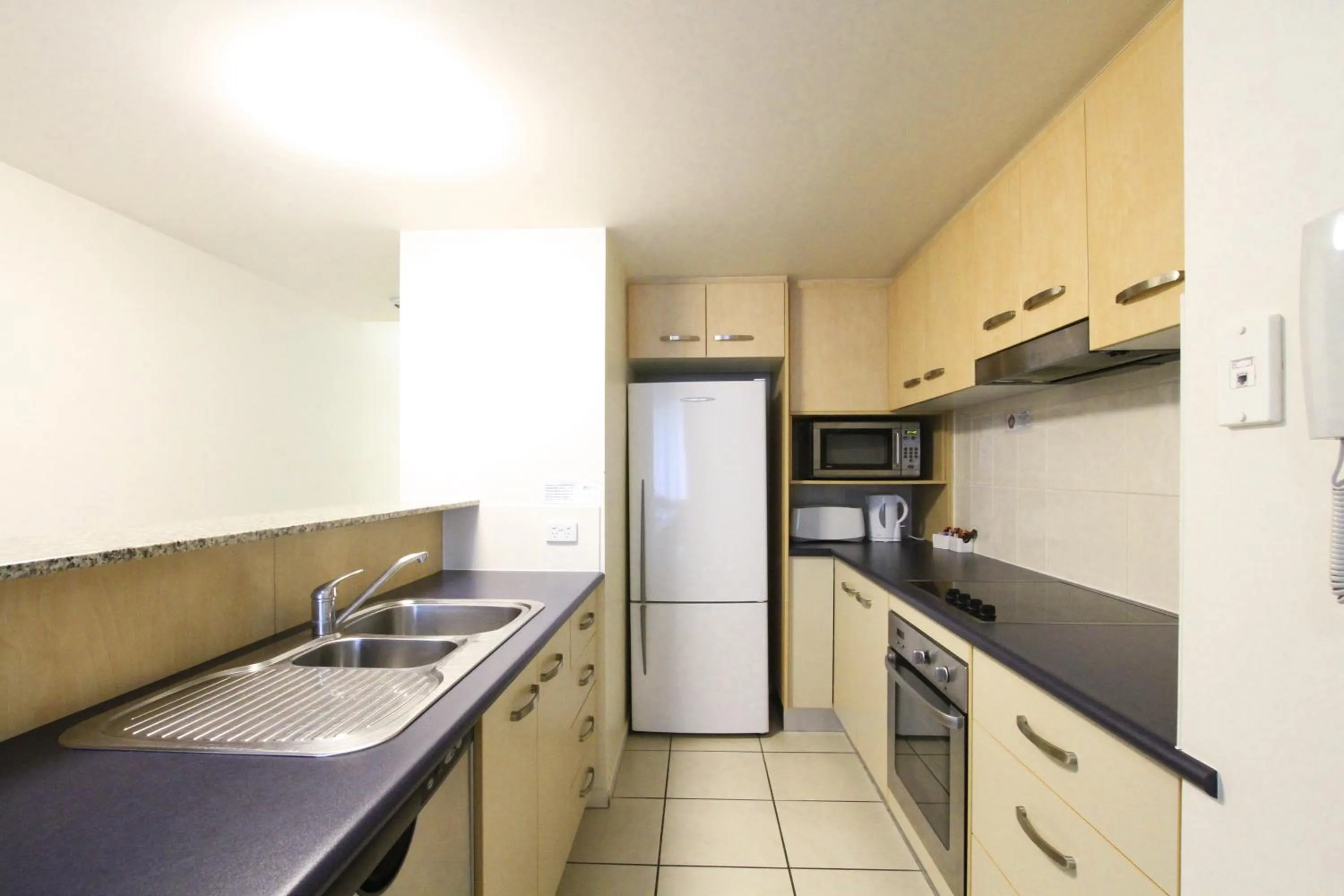 Kitchen or kitchenette in Caloundra Central Apartment Hotel Official