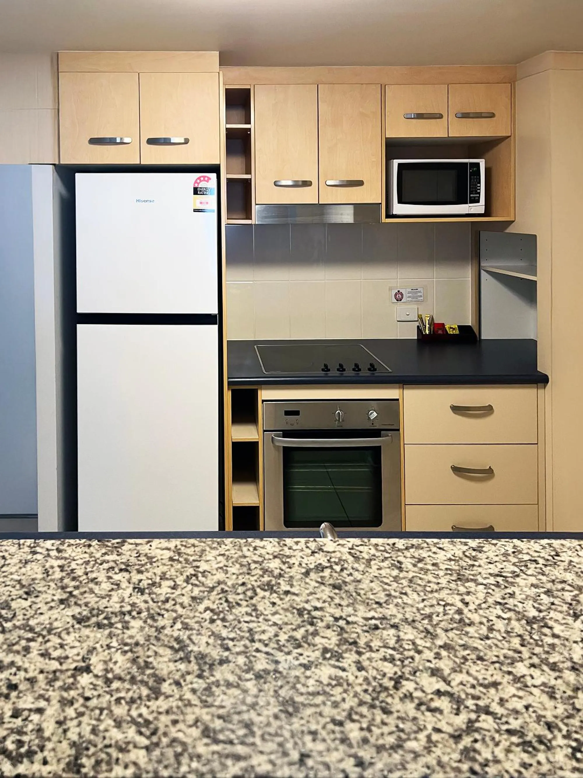 Kitchen or kitchenette in Caloundra Central Apartment Hotel Official