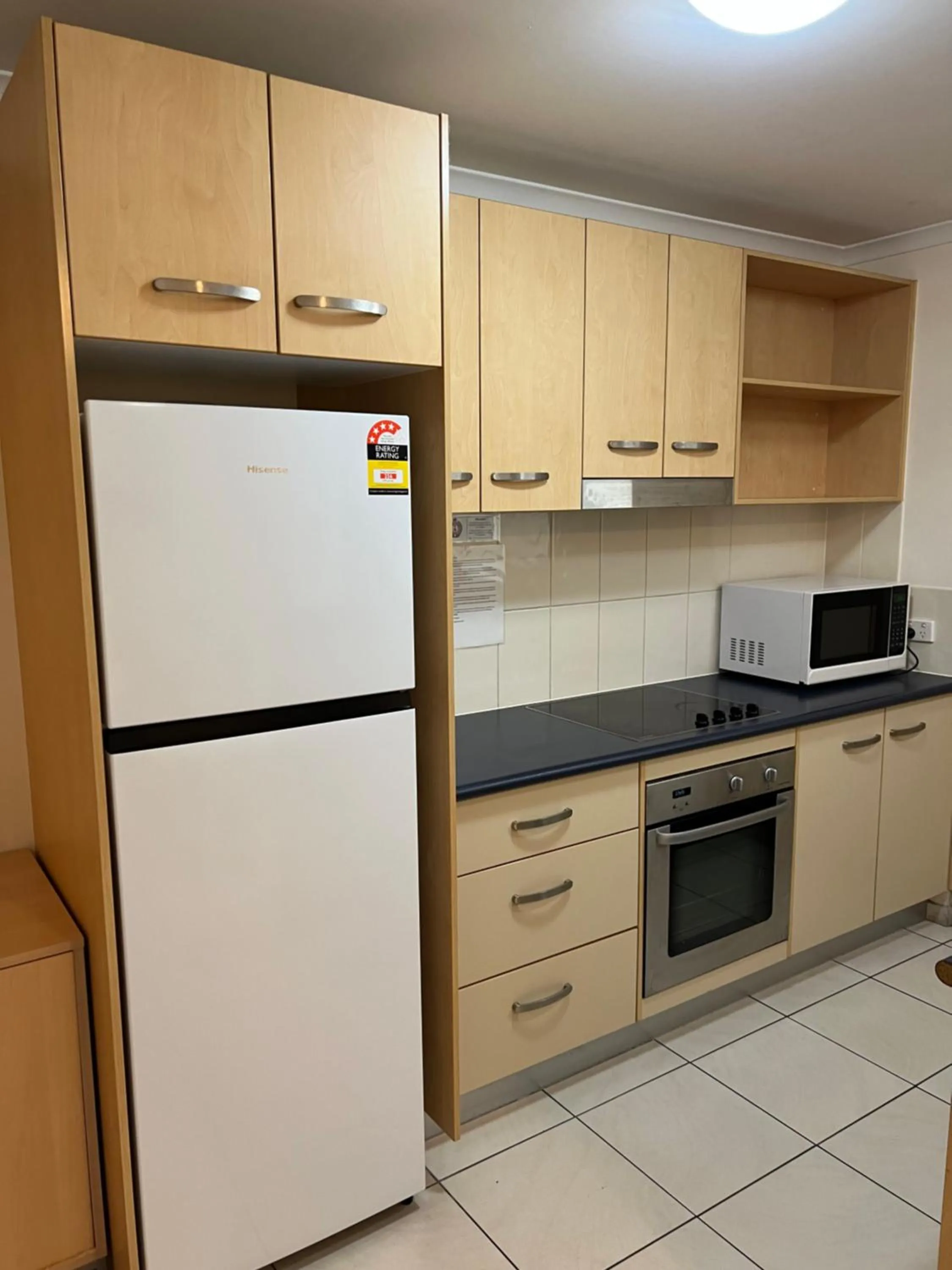 Kitchen or kitchenette in Caloundra Central Apartment Hotel Official