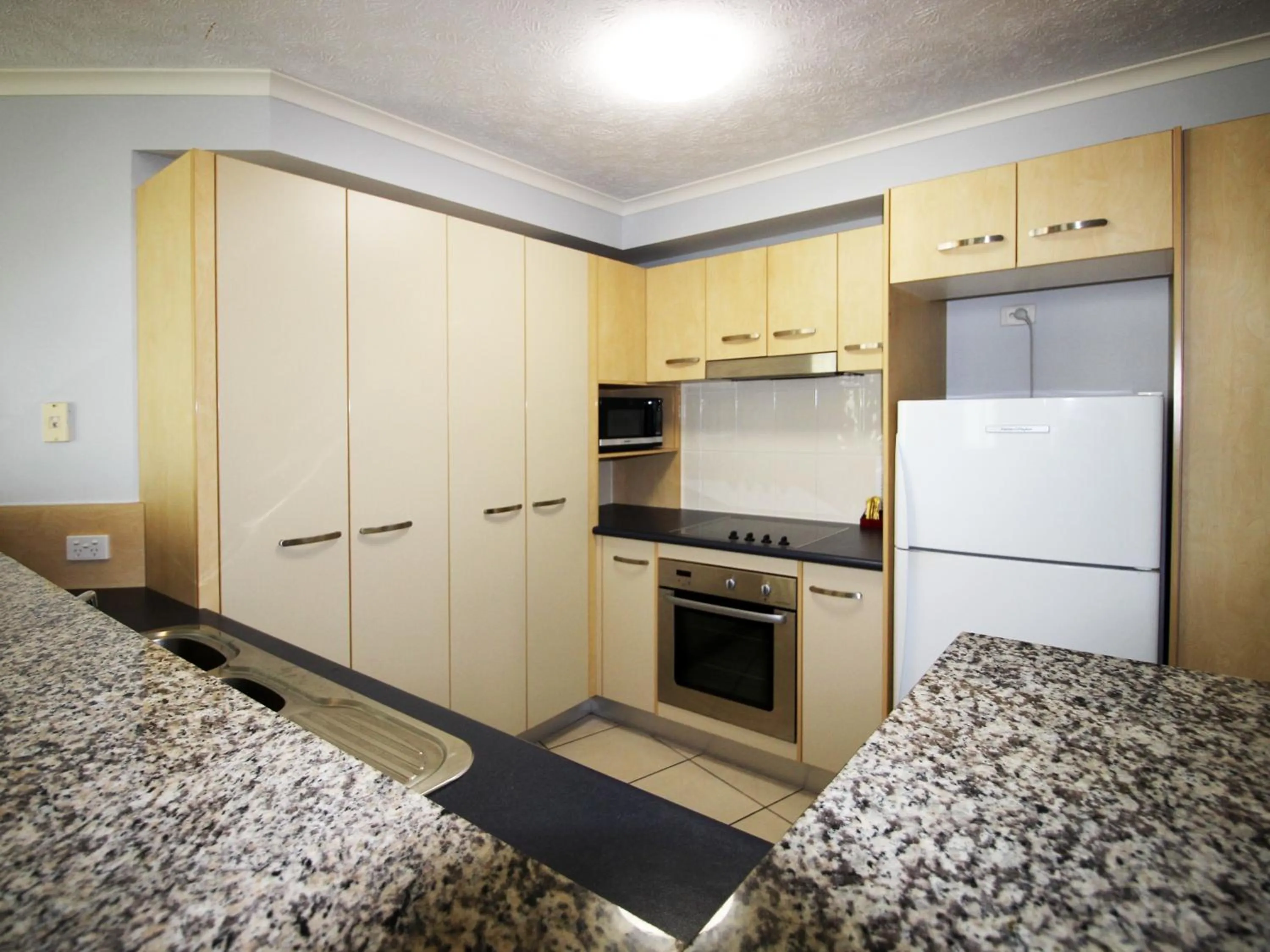kitchen in Caloundra Central Apartment Hotel Official
