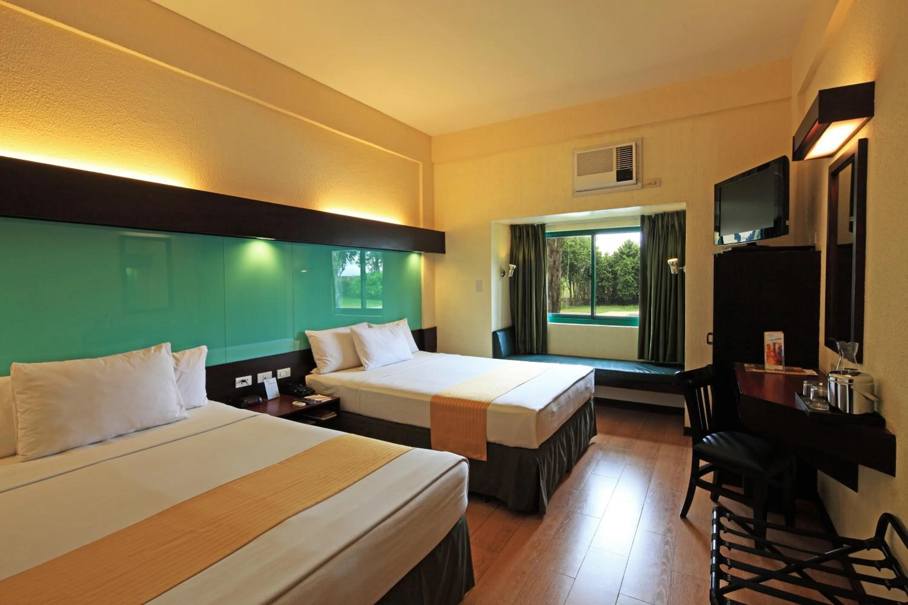 Photo of the whole room, Bed in Microtel by Wyndham Cabanatuan