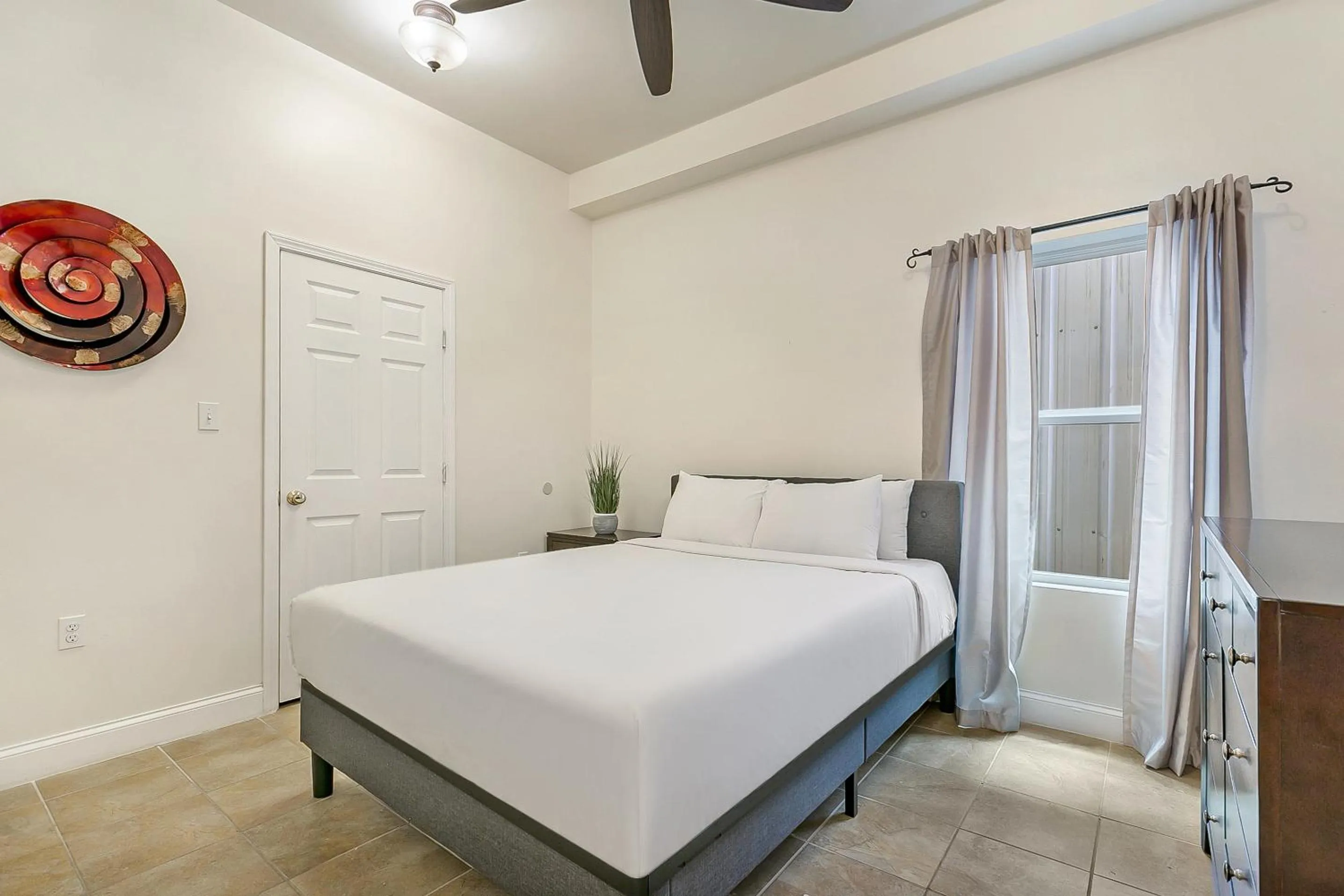 Bedroom, Bed in Urban Condos with Spacious Rooms & Amenities