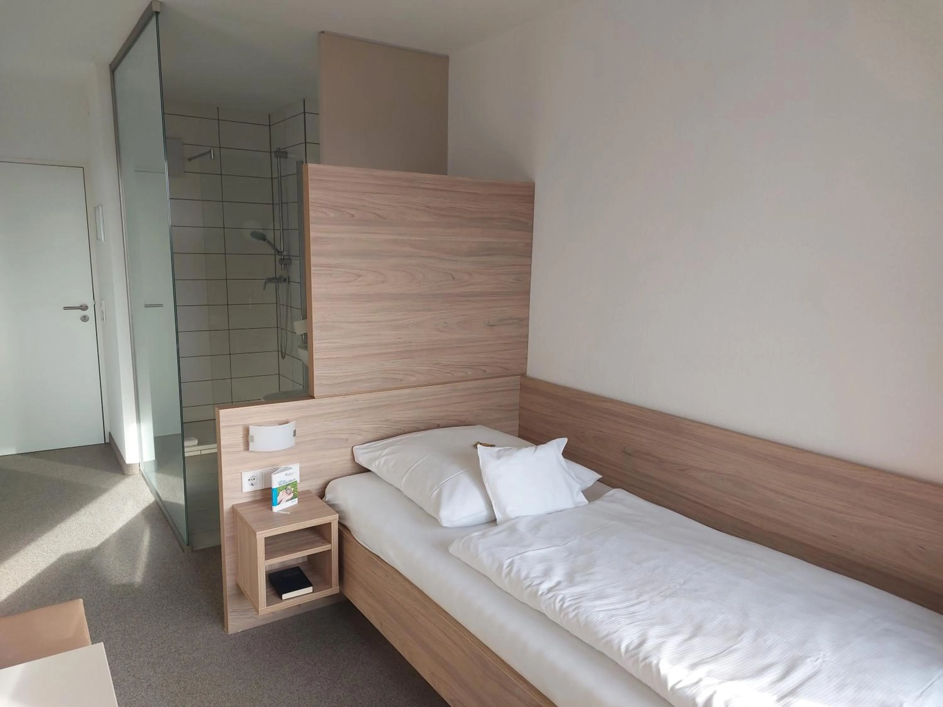 Photo of the whole room, Bed in Hotel am Schlossberg