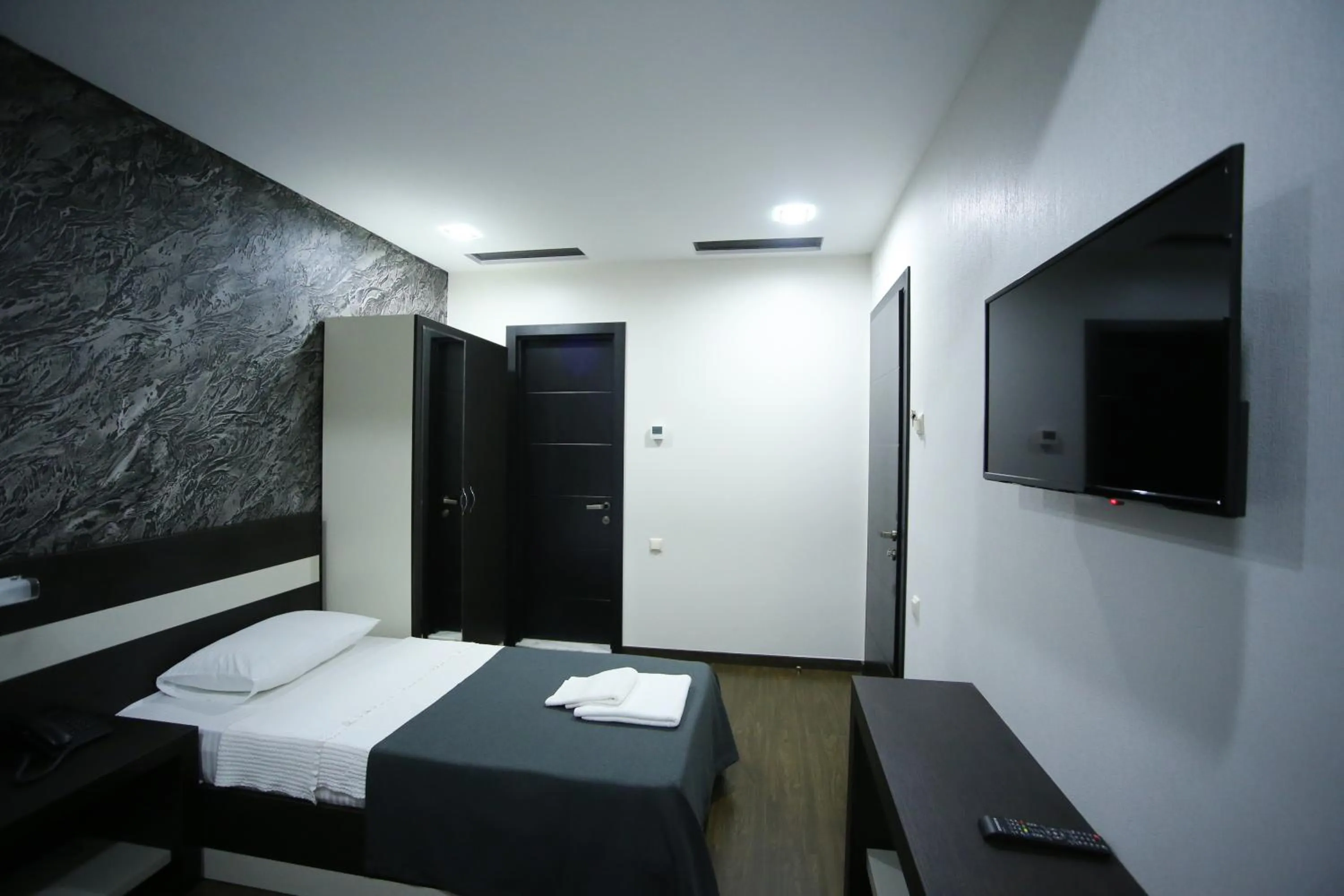 Bed in West Tower Hotel