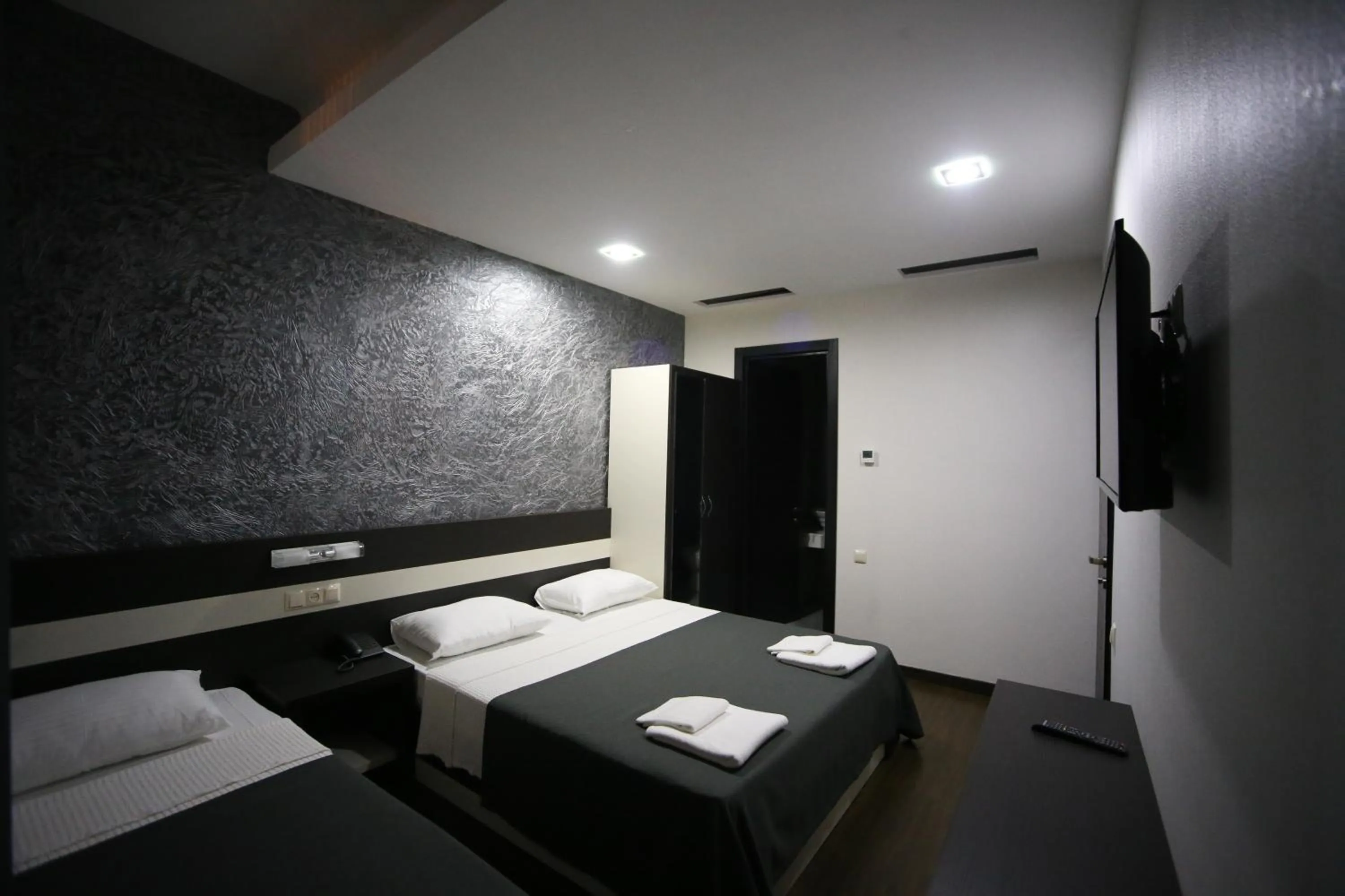 Bed in West Tower Hotel