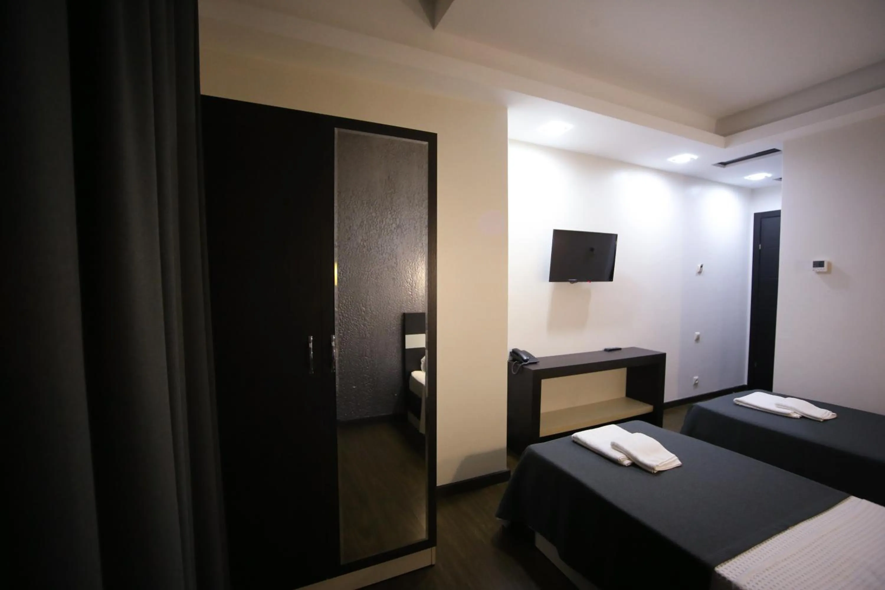 Bed in West Tower Hotel