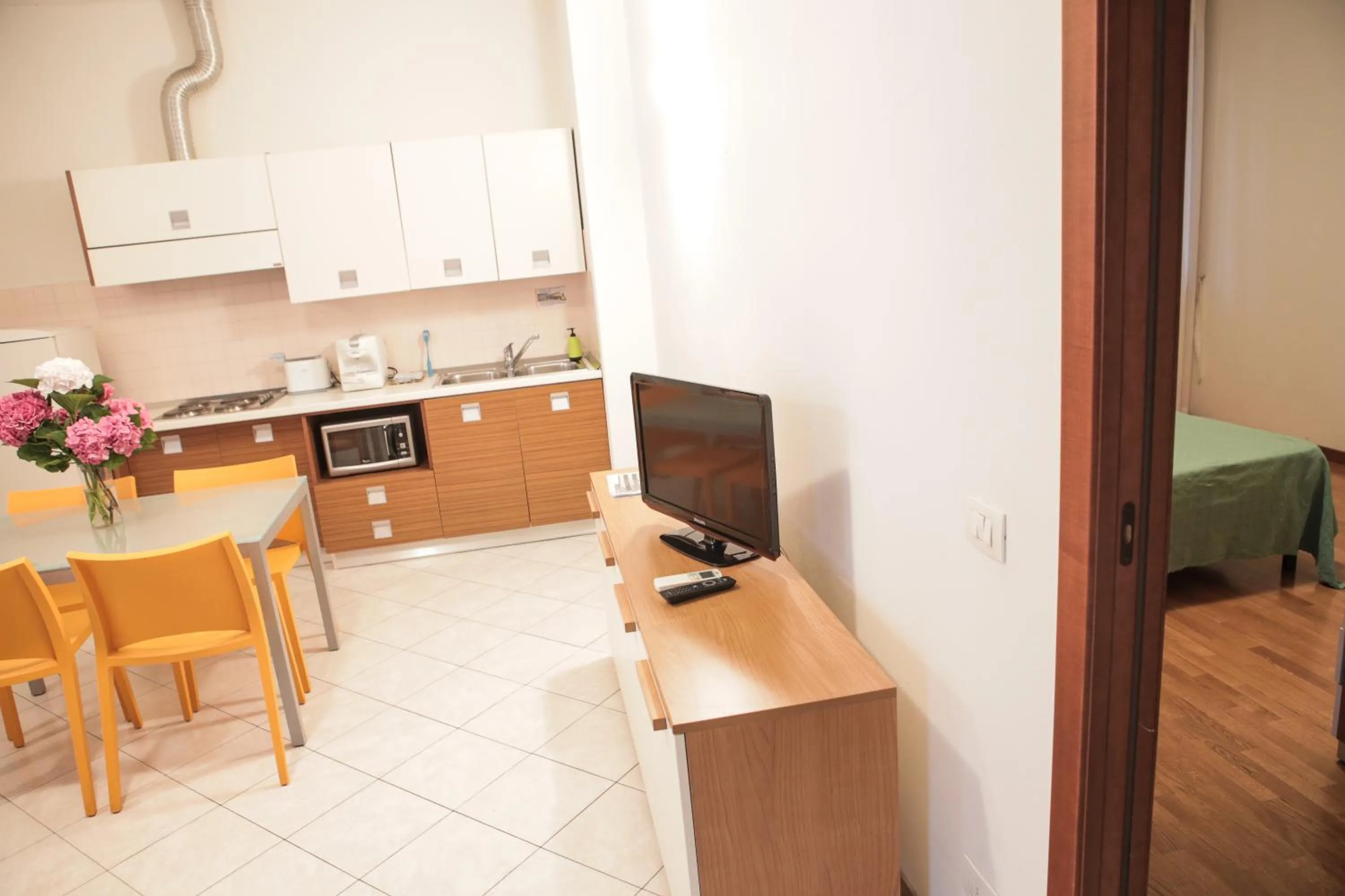 Kitchen or kitchenette in Verona Class ApartHotel "Residenze del Cuore"