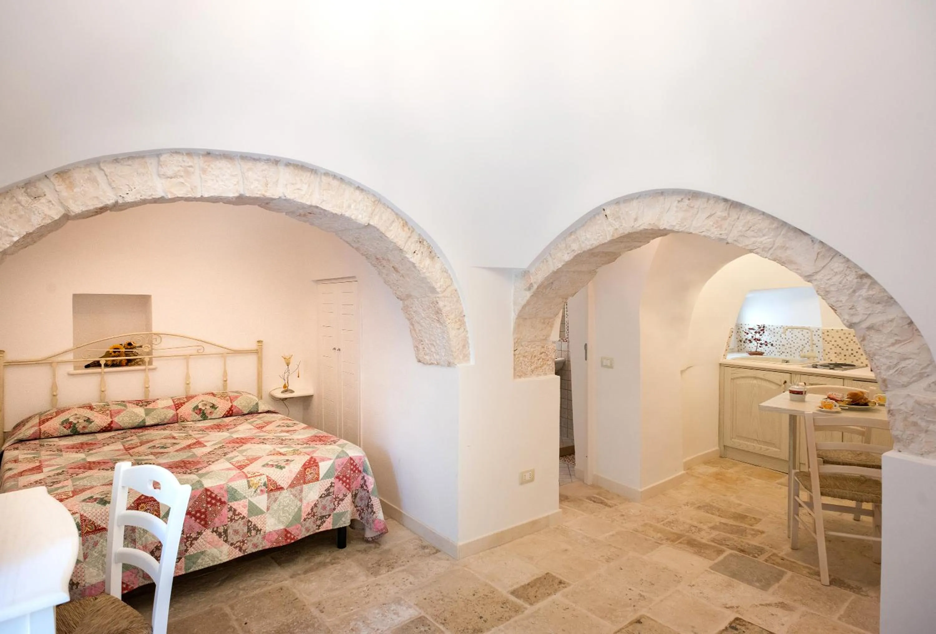 Bed in Trullo Giardino Fiorito