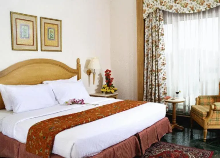 Photo of the whole room, Bed in Savoy Suites Noida