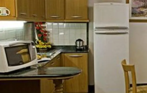 Kitchen or kitchenette in Savoy Suites Noida