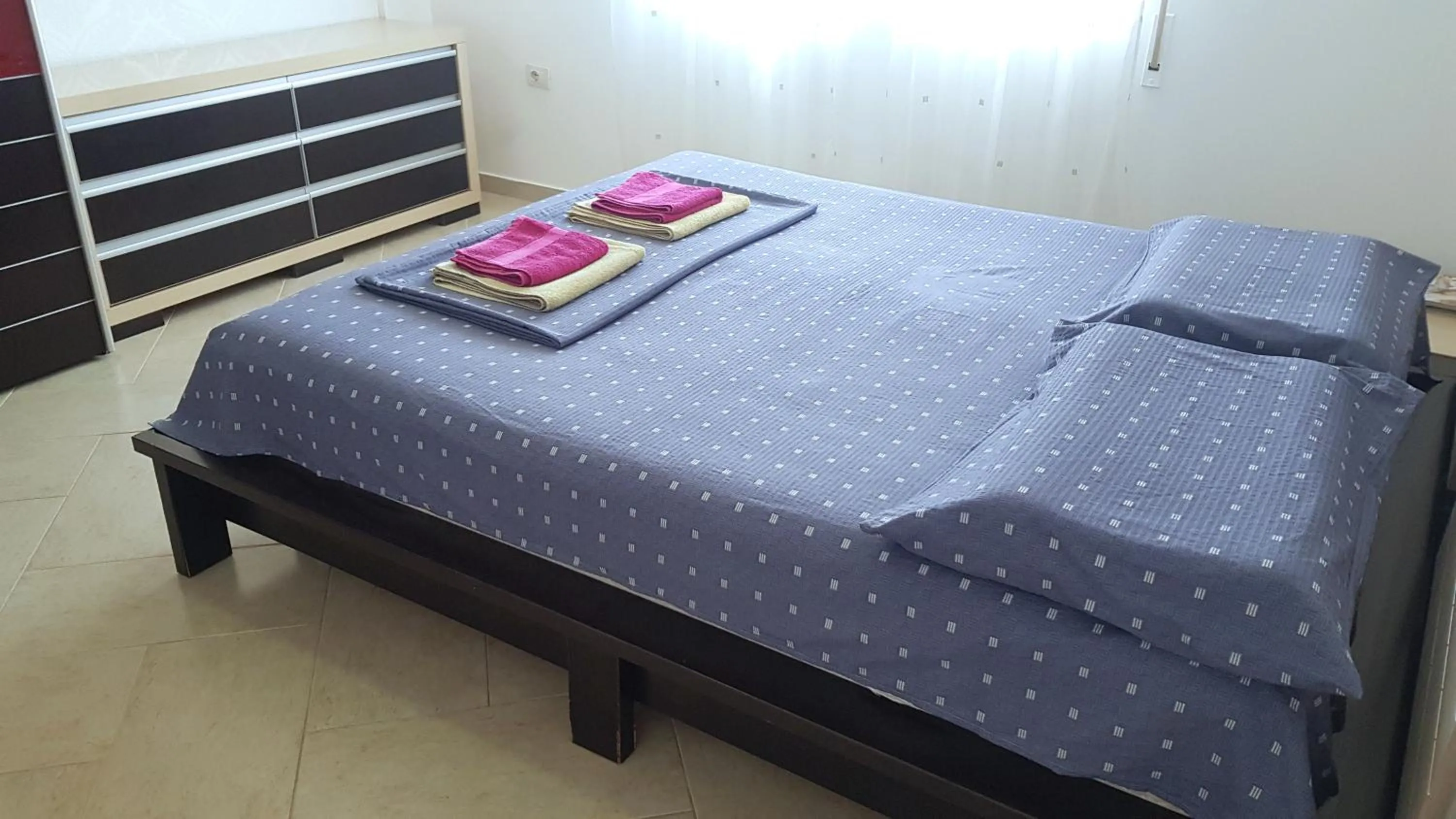 Bed in M&I Beach Apartment with Sea View