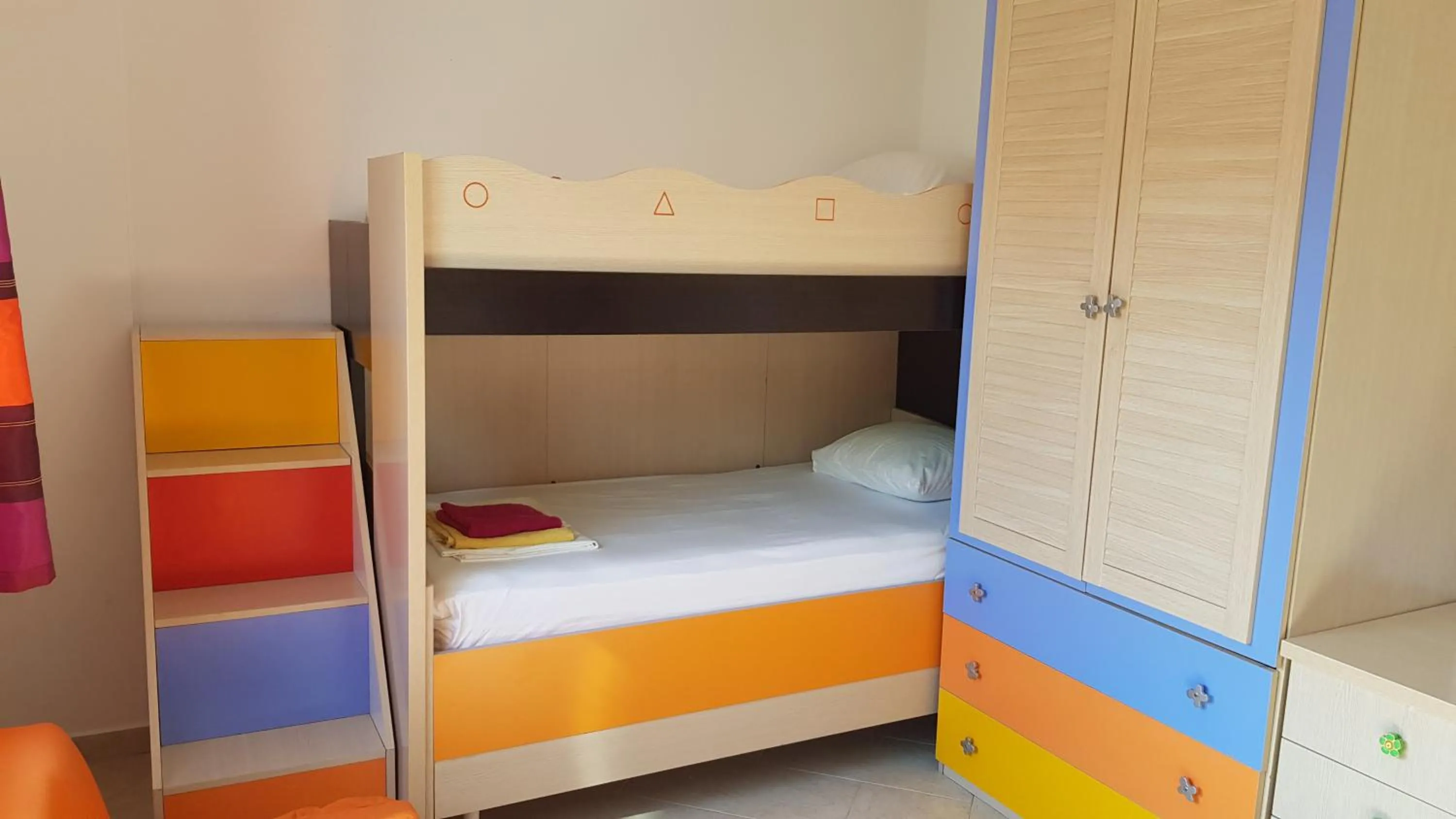 Bed in M&I Beach Apartment with Sea View