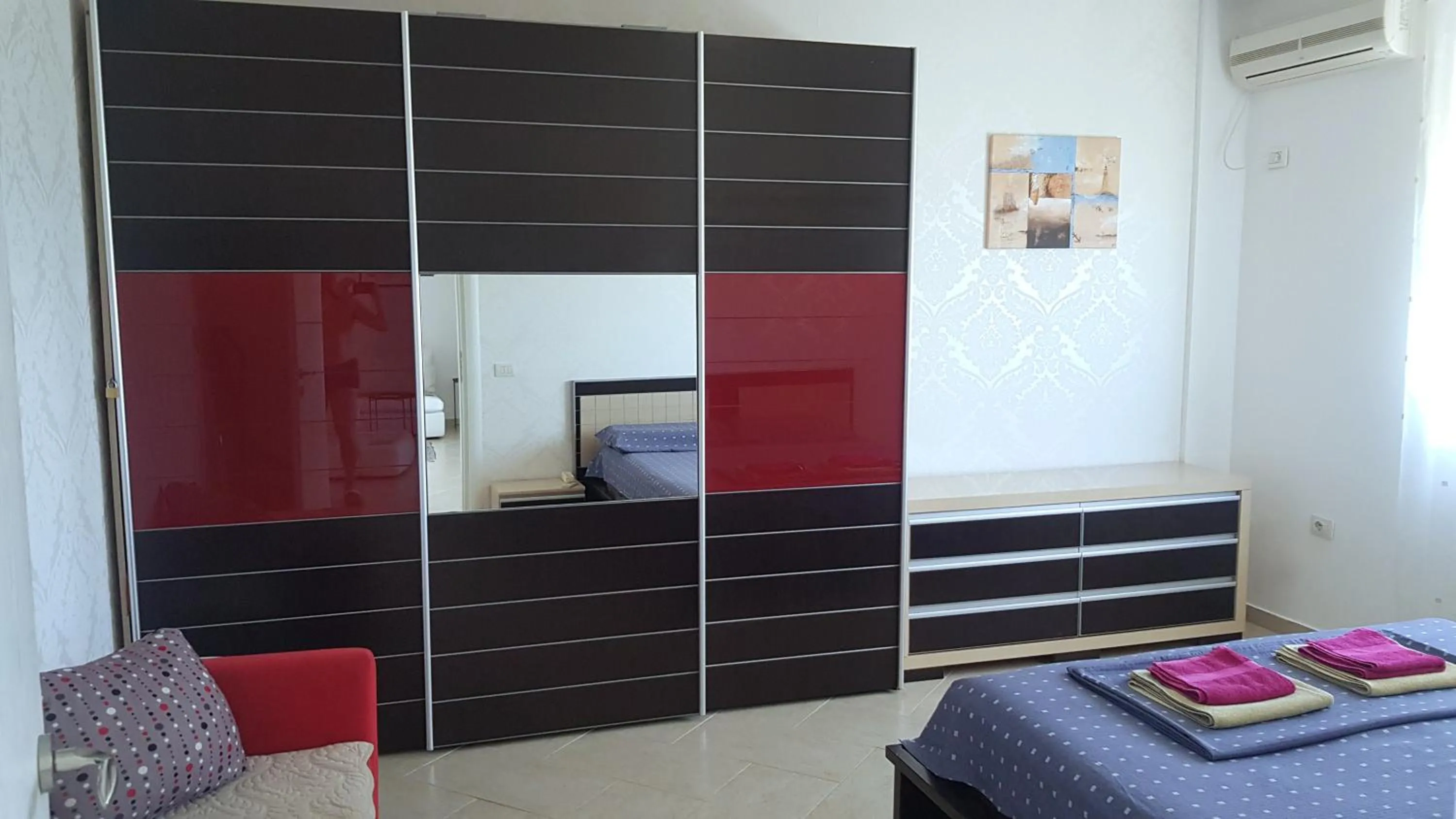 Bed in M&I Beach Apartment with Sea View