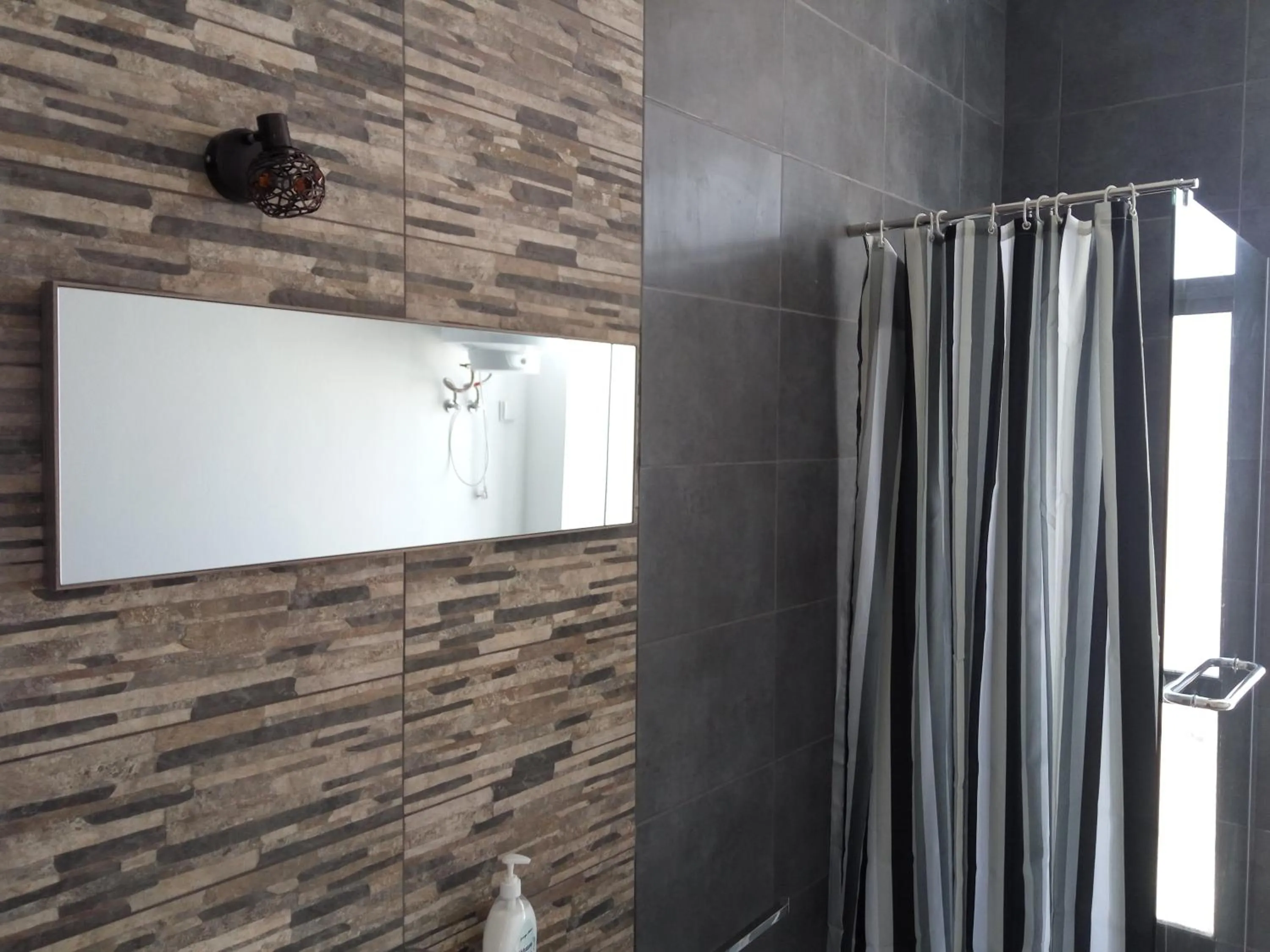 Bathroom in Faro Cosy Guesthouse