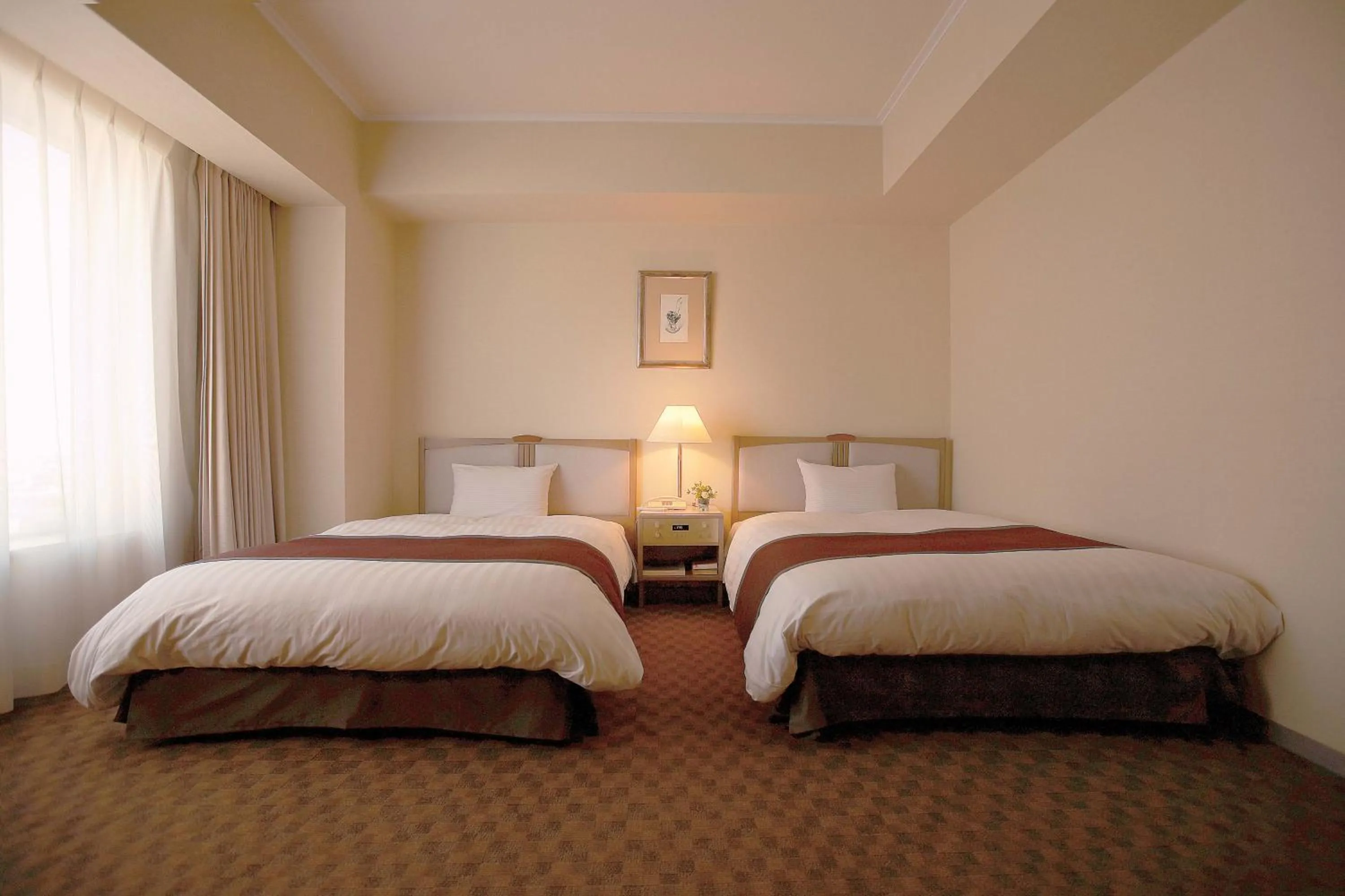 Bed in Miyako Hotel Yokkaichi