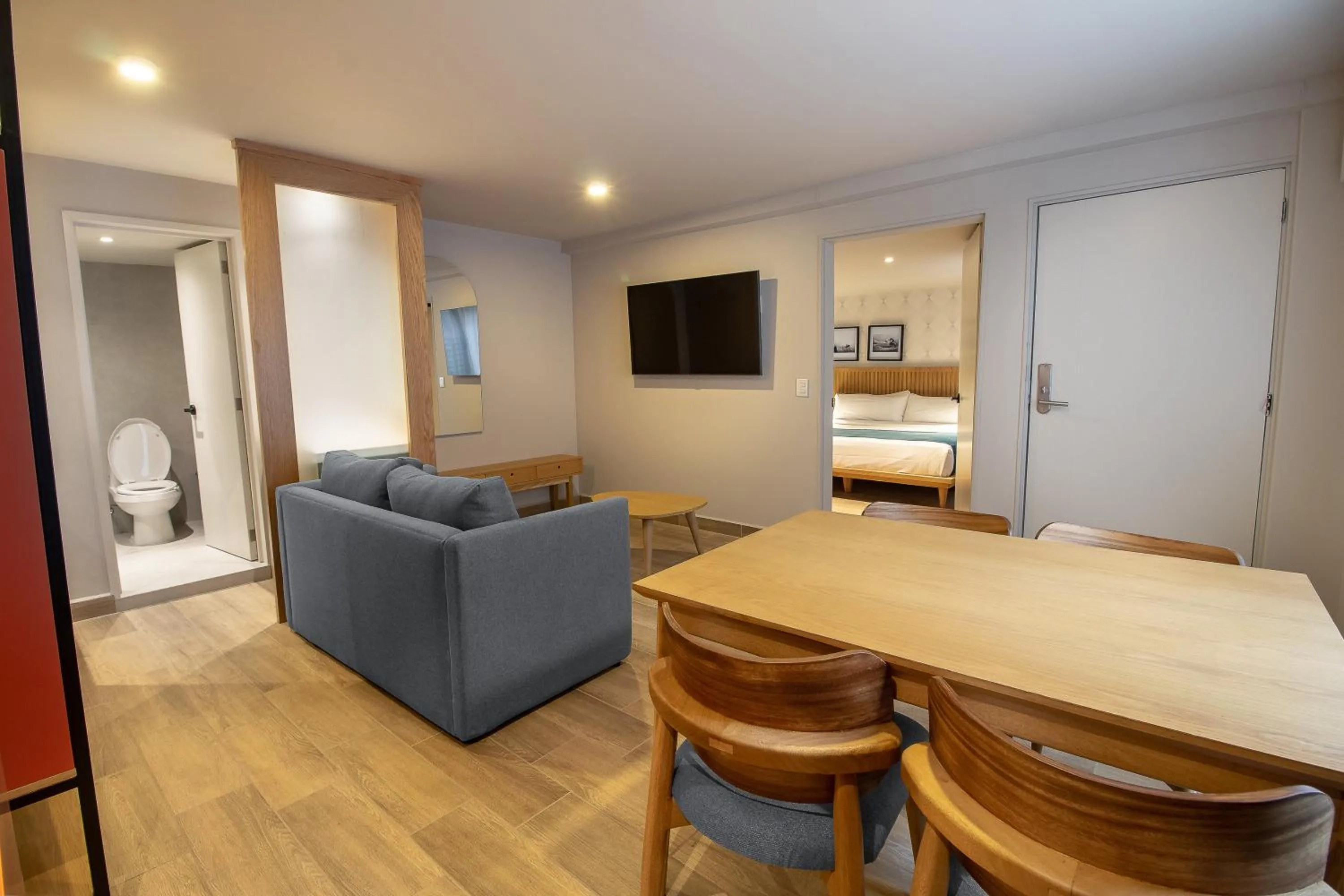 Communal lounge/ TV room in Oliva Plaza Hotel