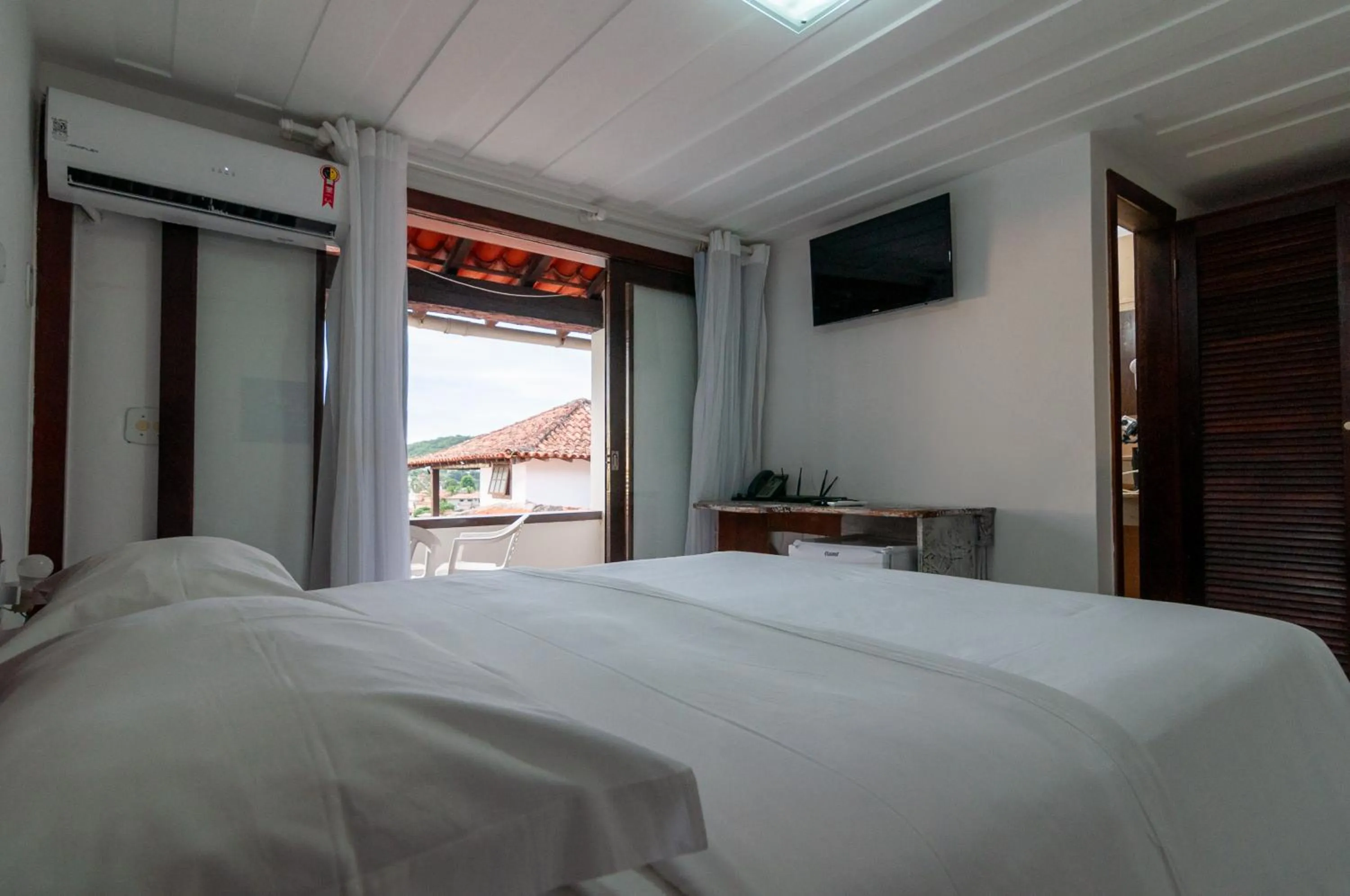 Bedroom in Buzios Arambaré Hotel