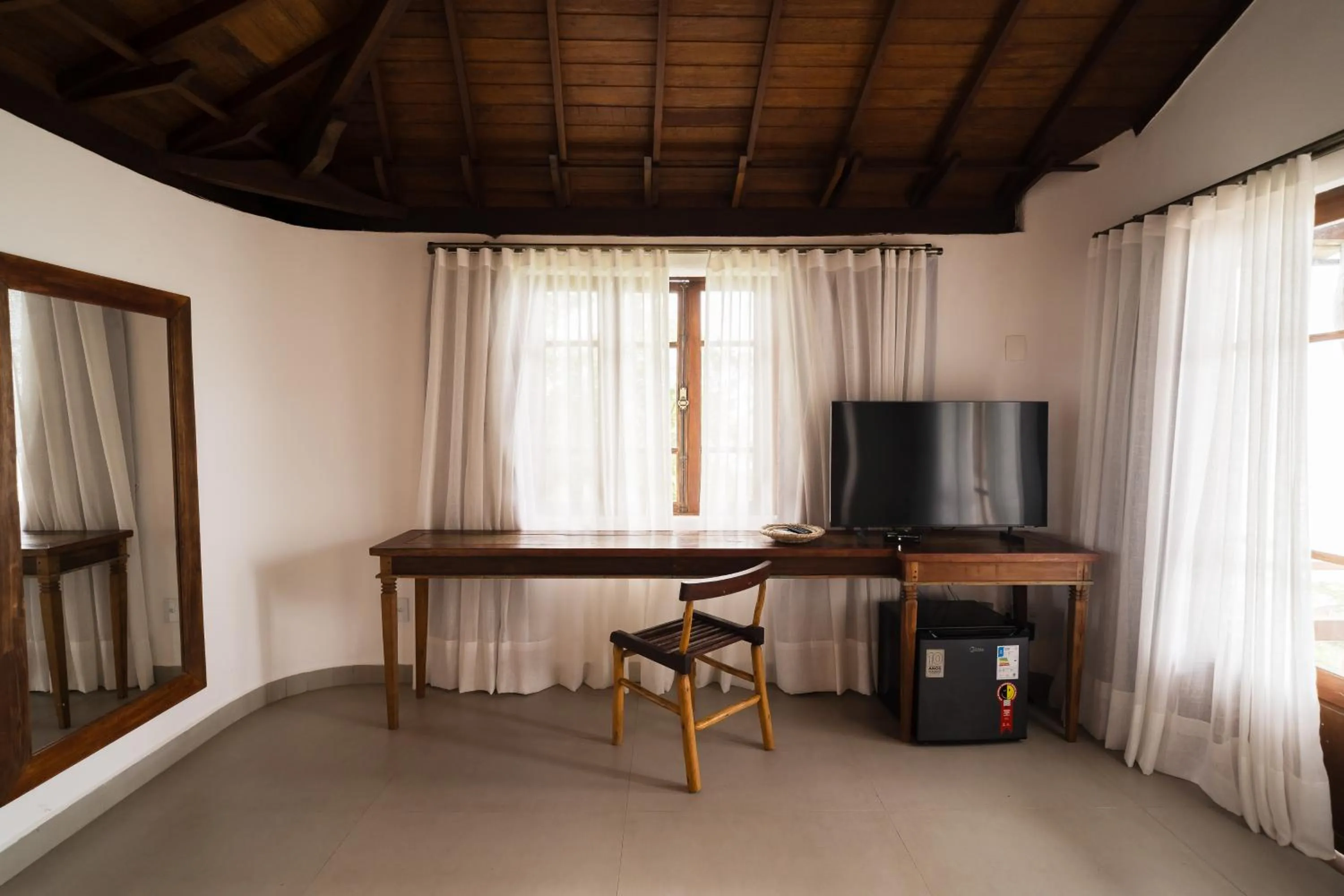 Communal lounge/ TV room in Beijo do Vento Pousada