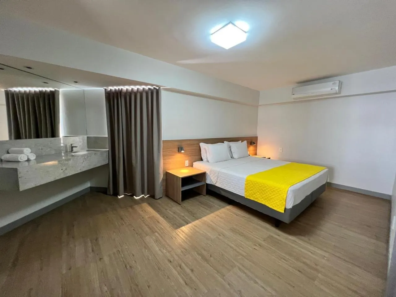 Bed in San Marino Suite Hotel