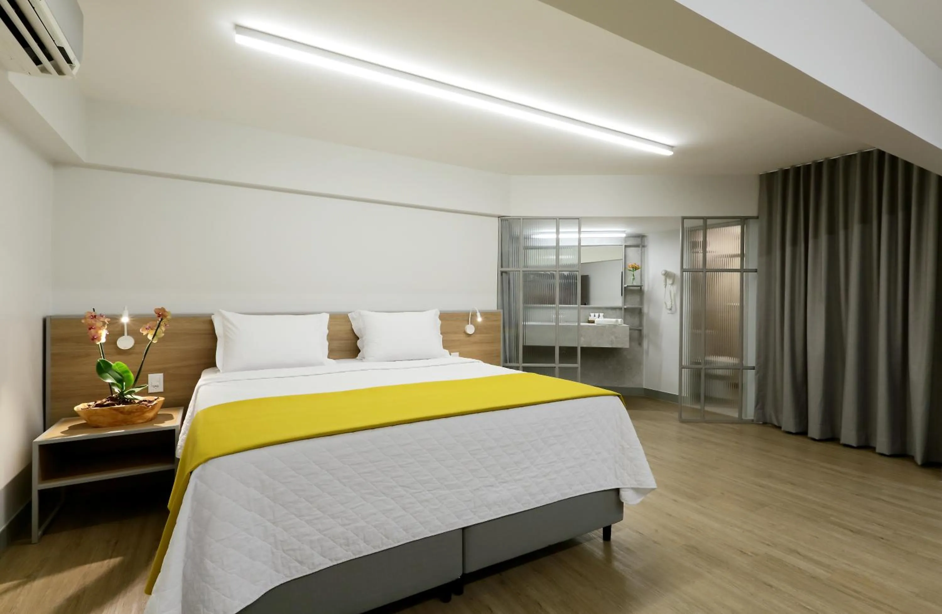 Bed in San Marino Suite Hotel