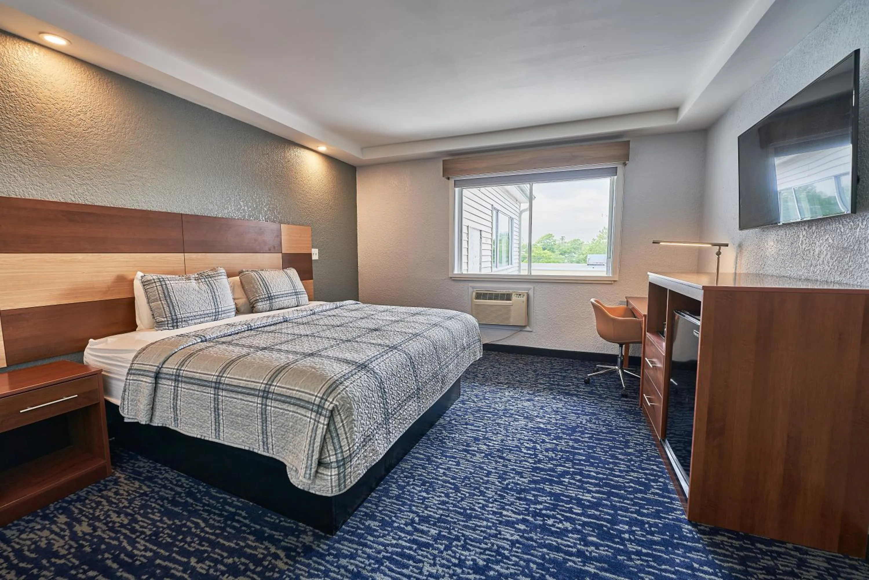 Bed in Hyannis Plaza Hotel