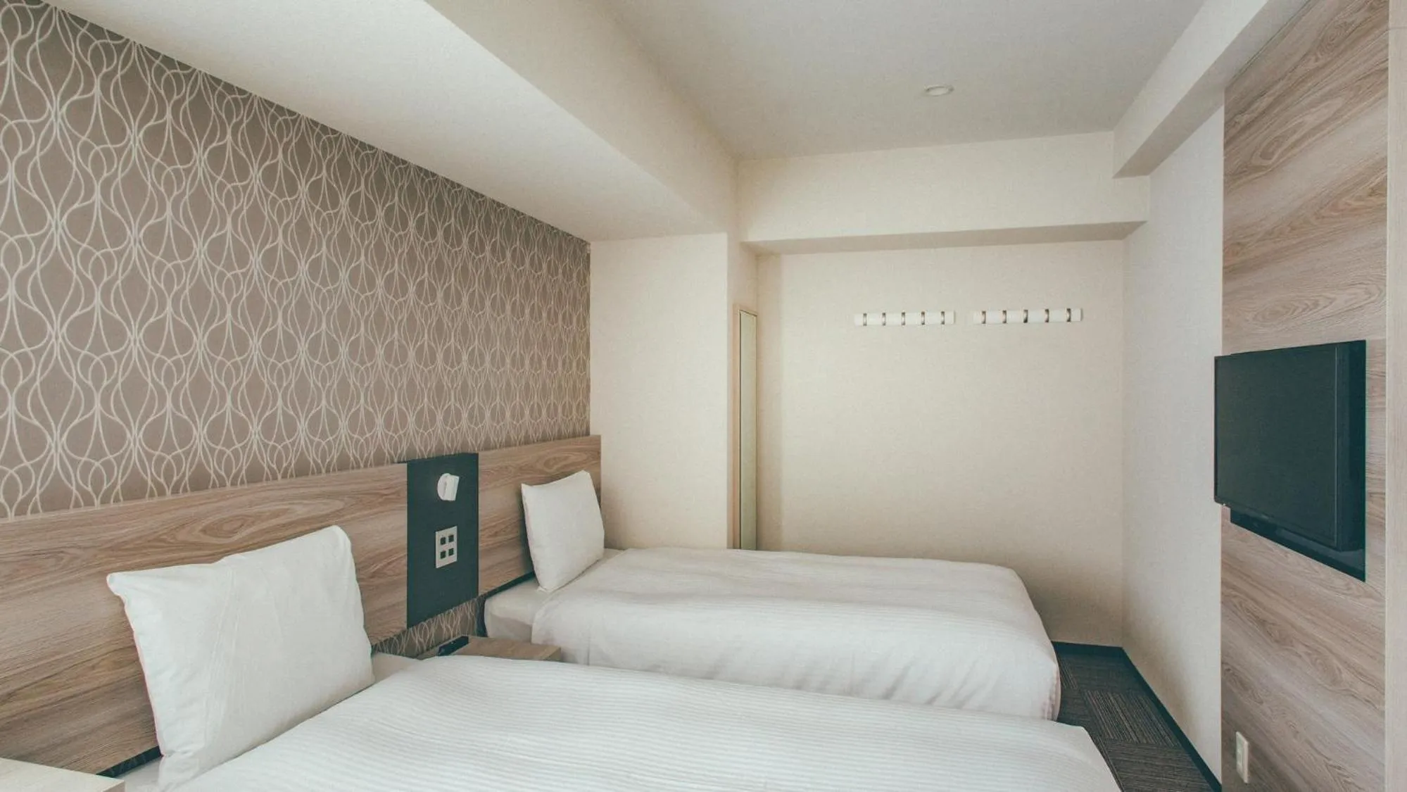 Bed in Kuretake Inn Premium Nagoya Nayabashi