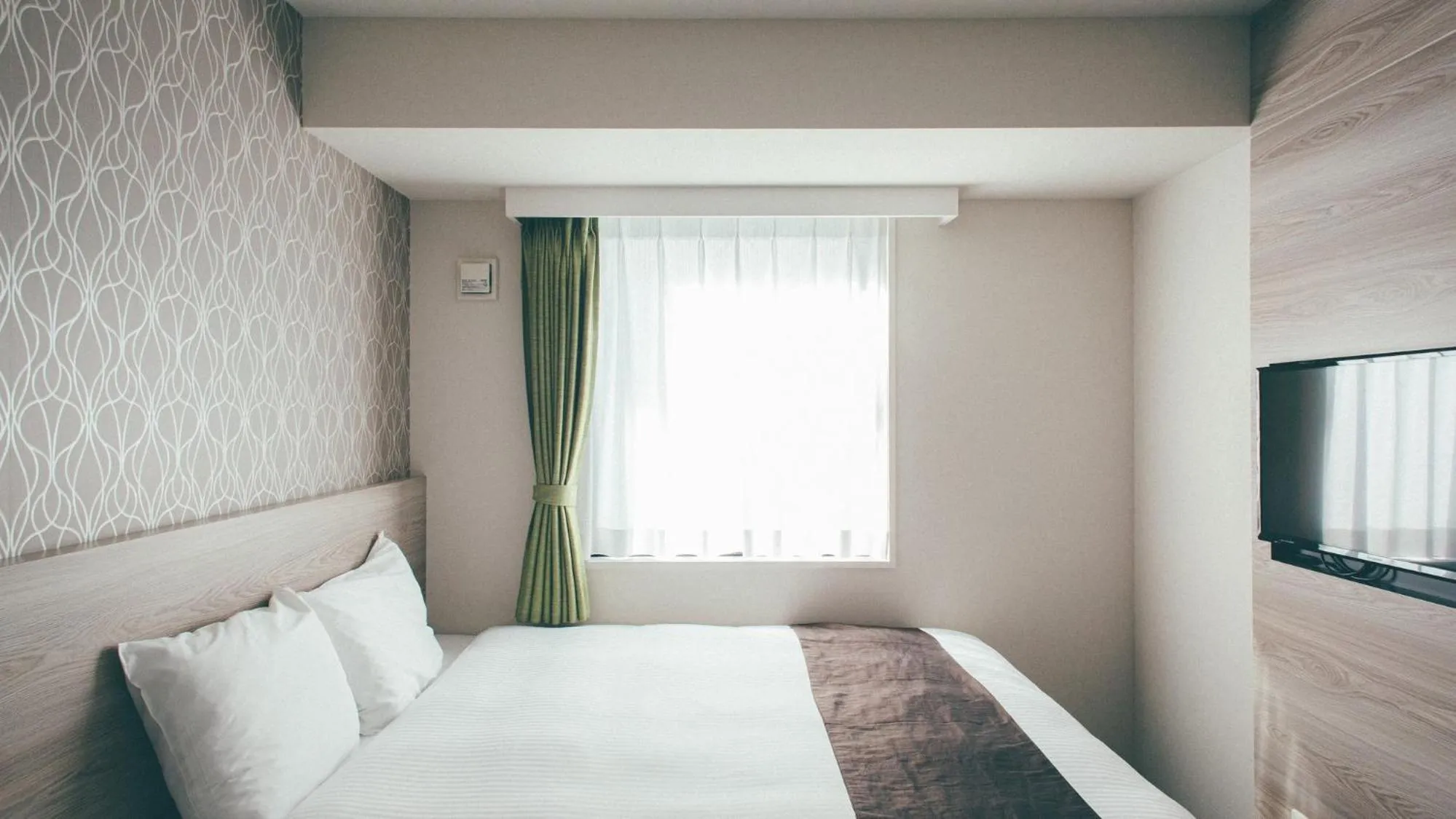 Bed in Kuretake Inn Premium Nagoya Nayabashi