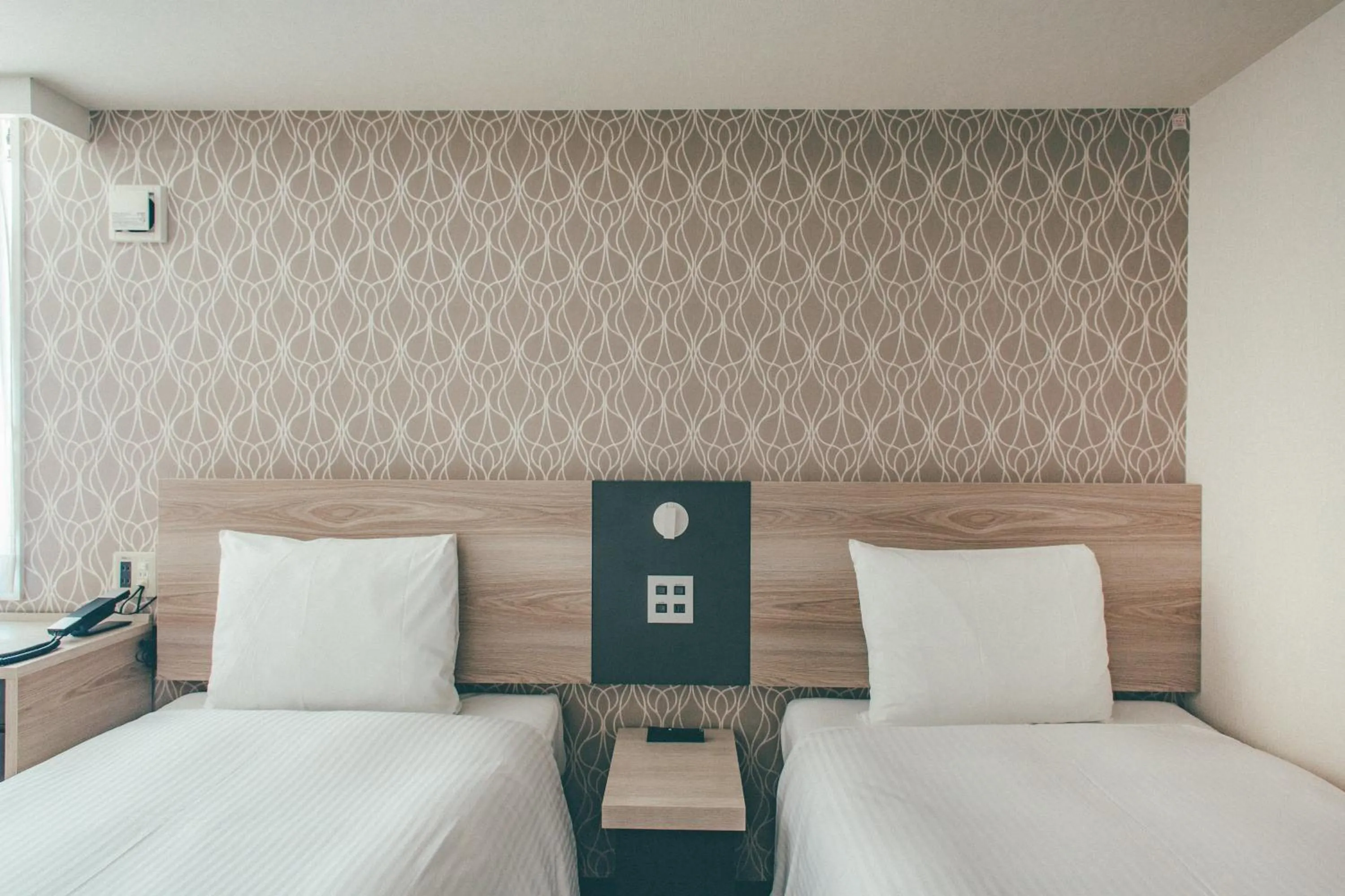 Bed in Kuretake Inn Premium Nagoya Nayabashi