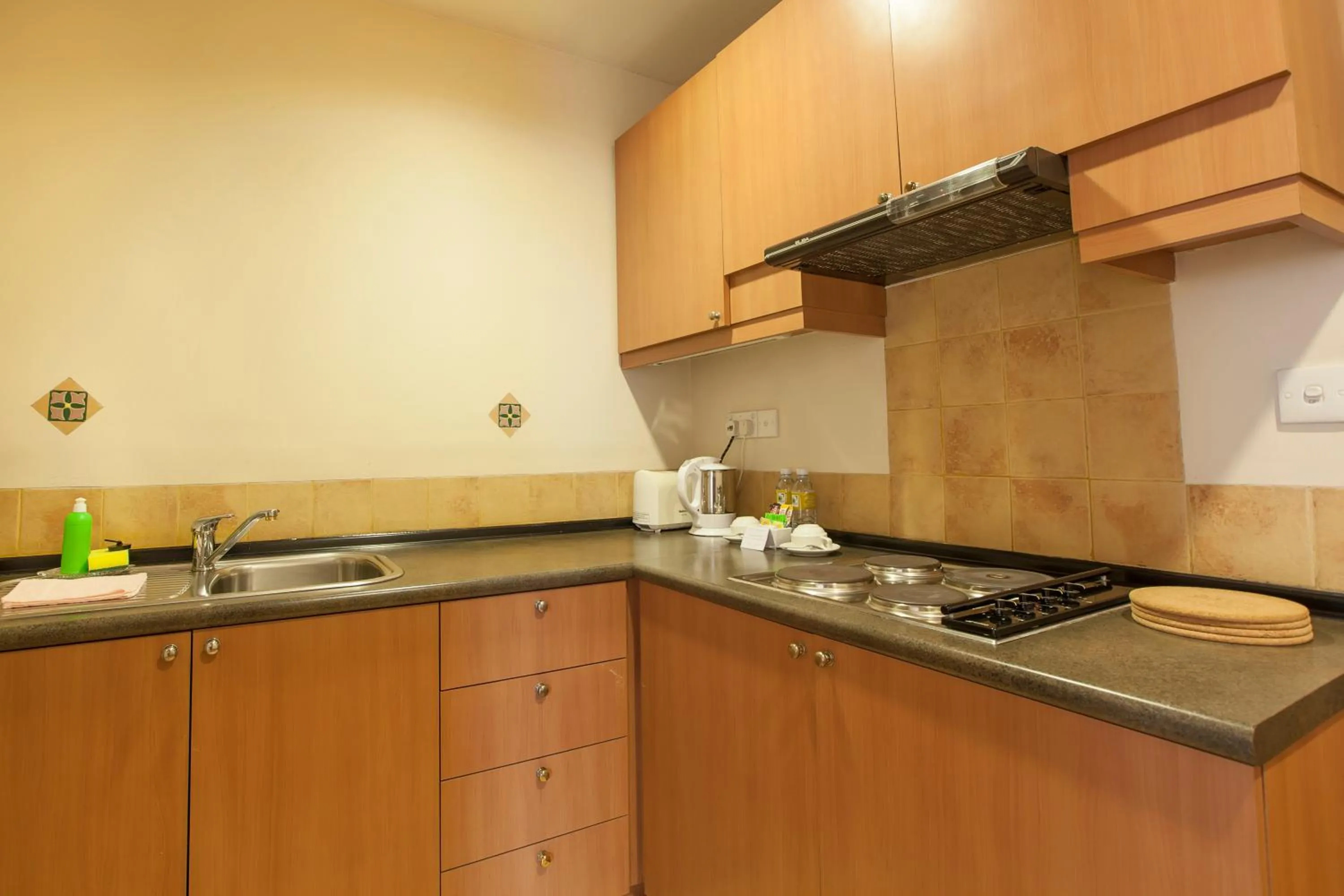 Kitchen or kitchenette in Himawari Hotel Apartments