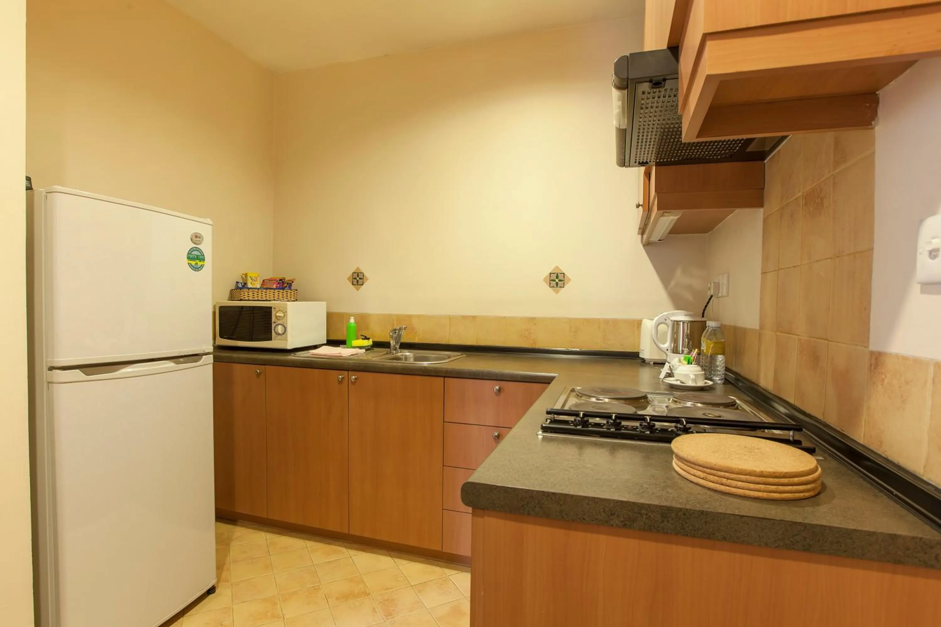 Kitchen or kitchenette in Himawari Hotel Apartments