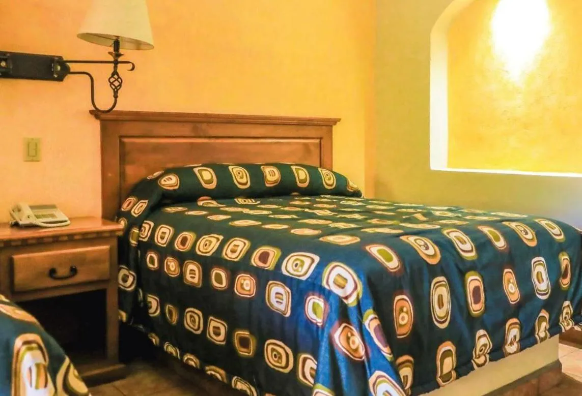 Bed in Hacienda Suites Loreto