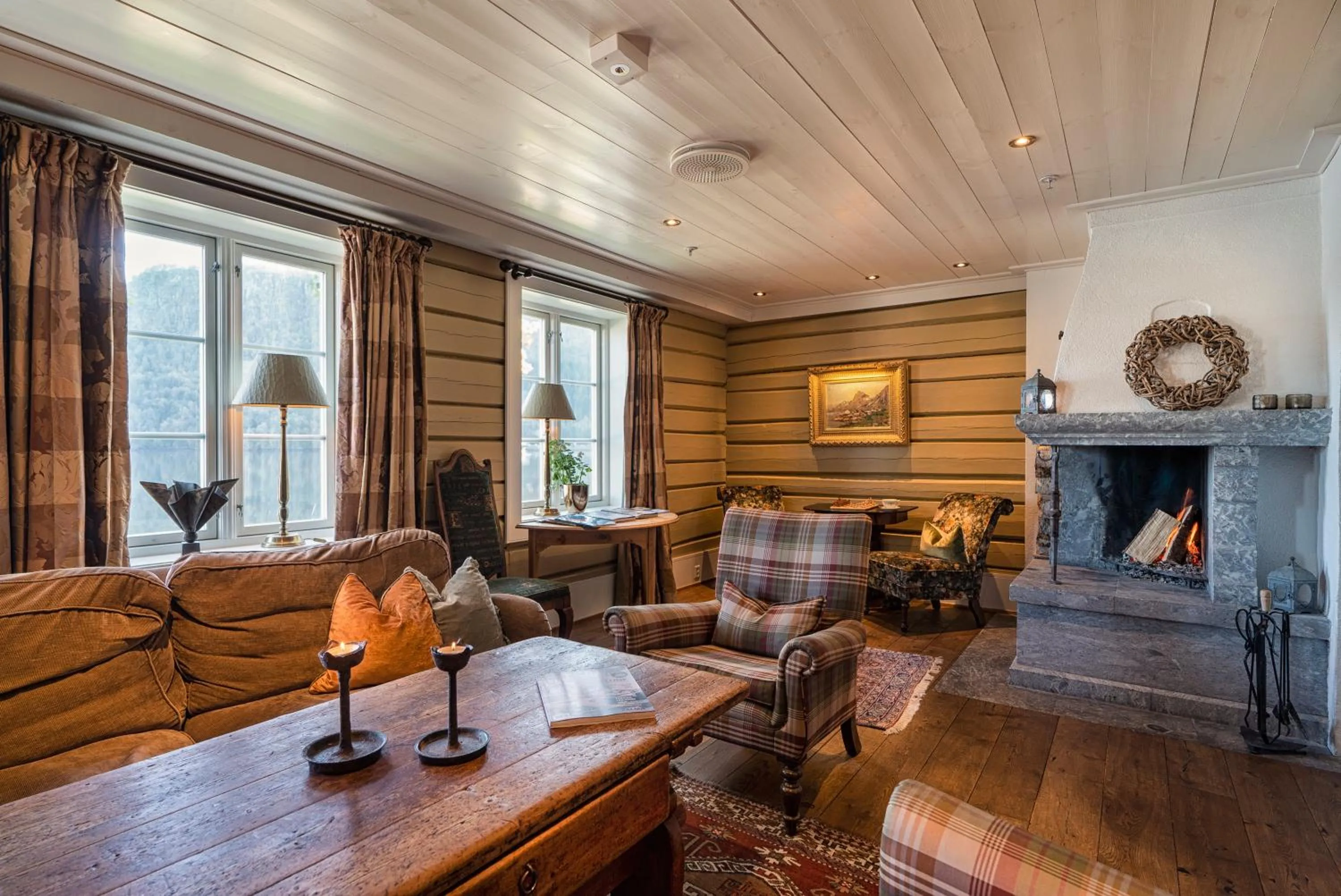 Communal lounge/ TV room in Angvik Gamle Handelssted - by Classic Norway Hotels