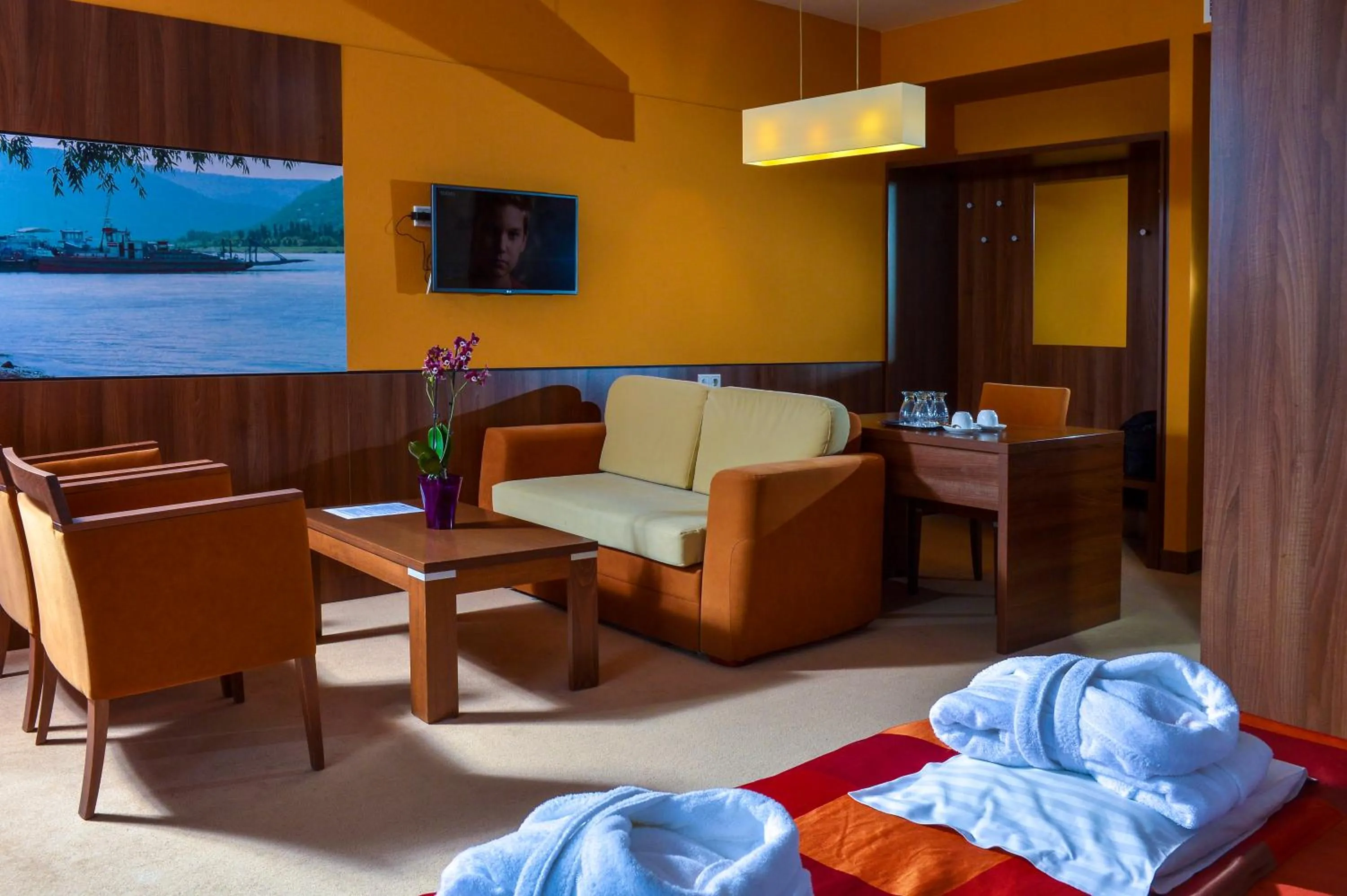 Seating area, Bed in Royal Club Hotel