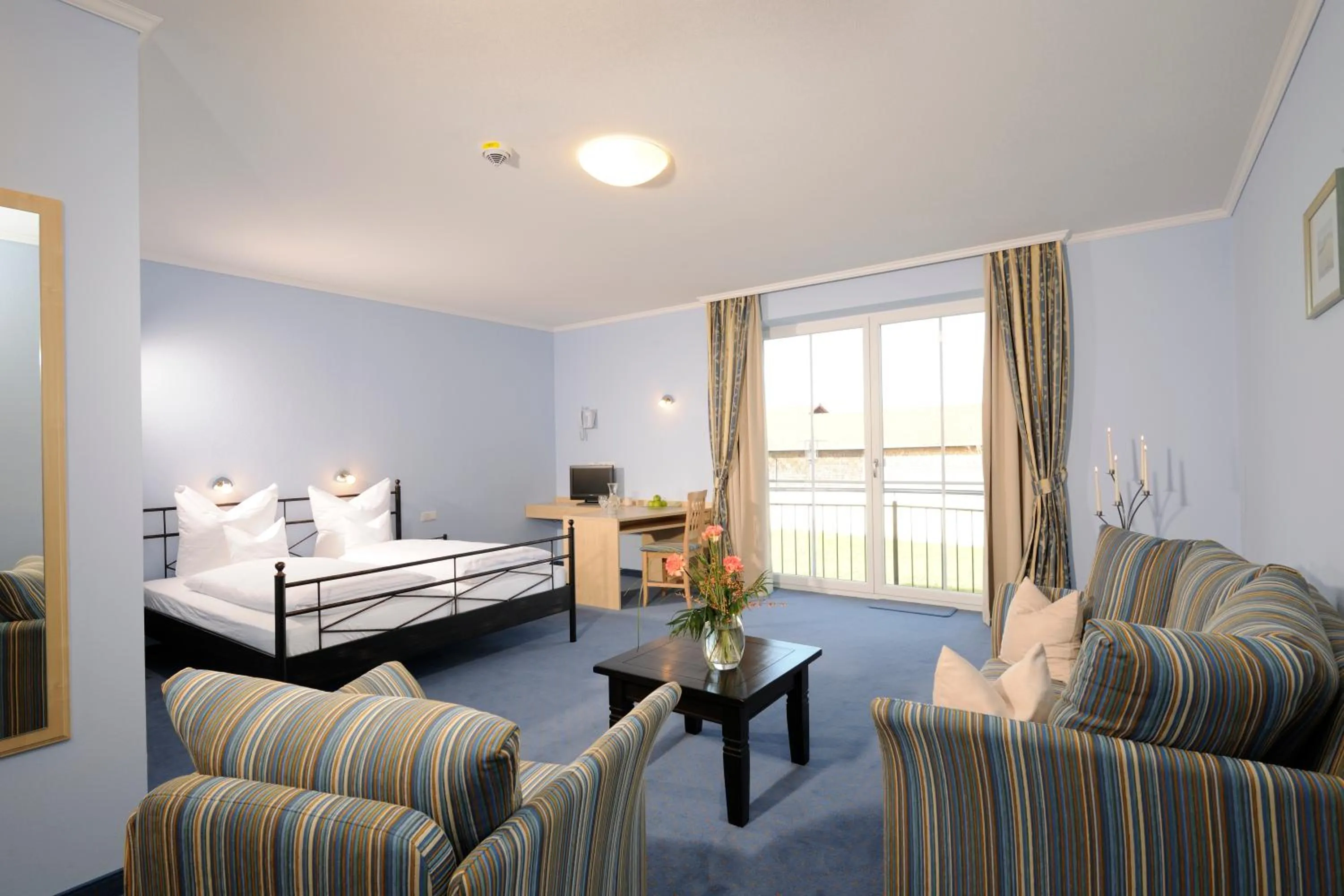 Living room, Bed in Hotel Inspiration Garni