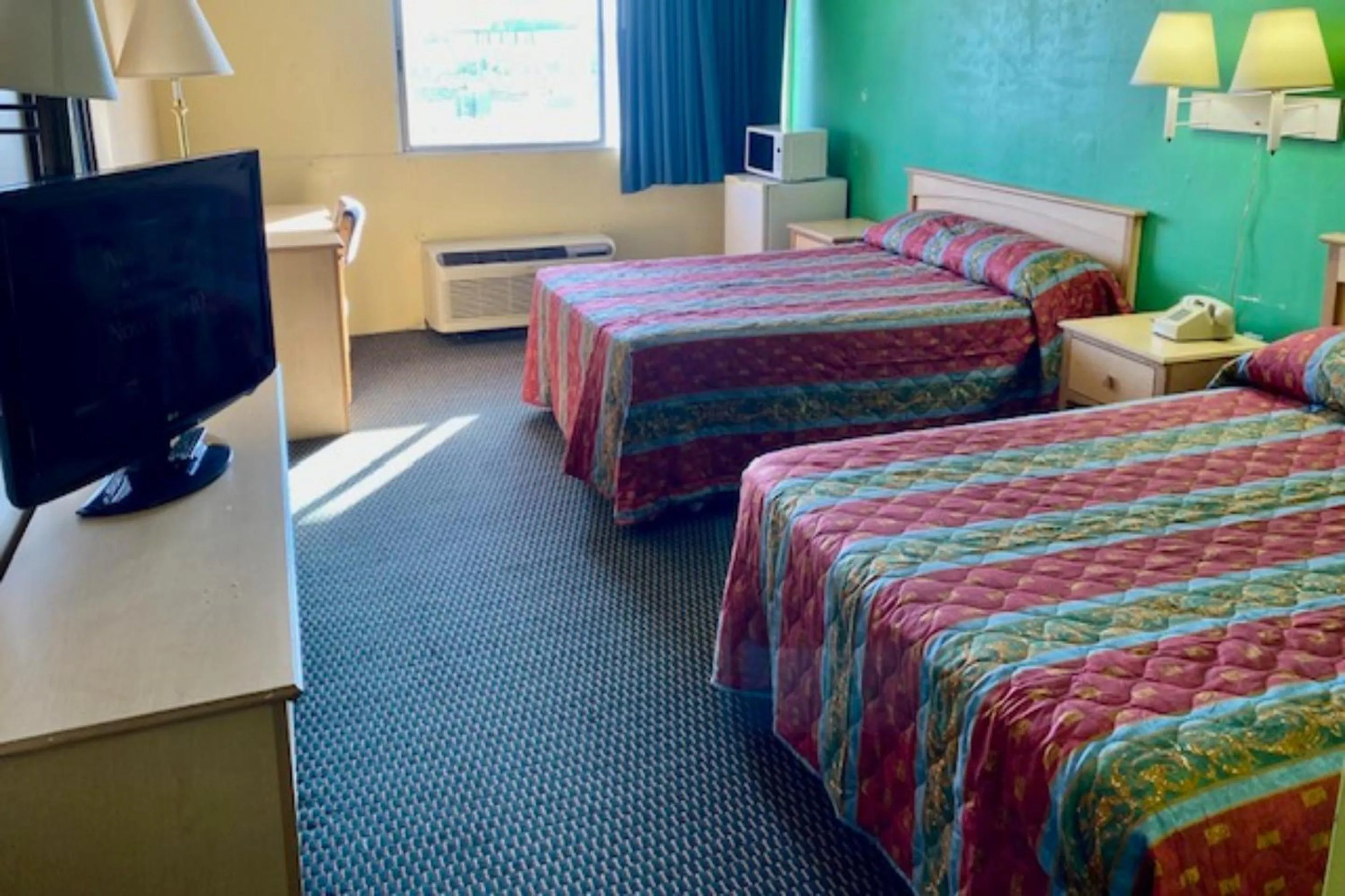 Bedroom, Bed in Red Carpet Inn & Suites Lima -Listing Partner