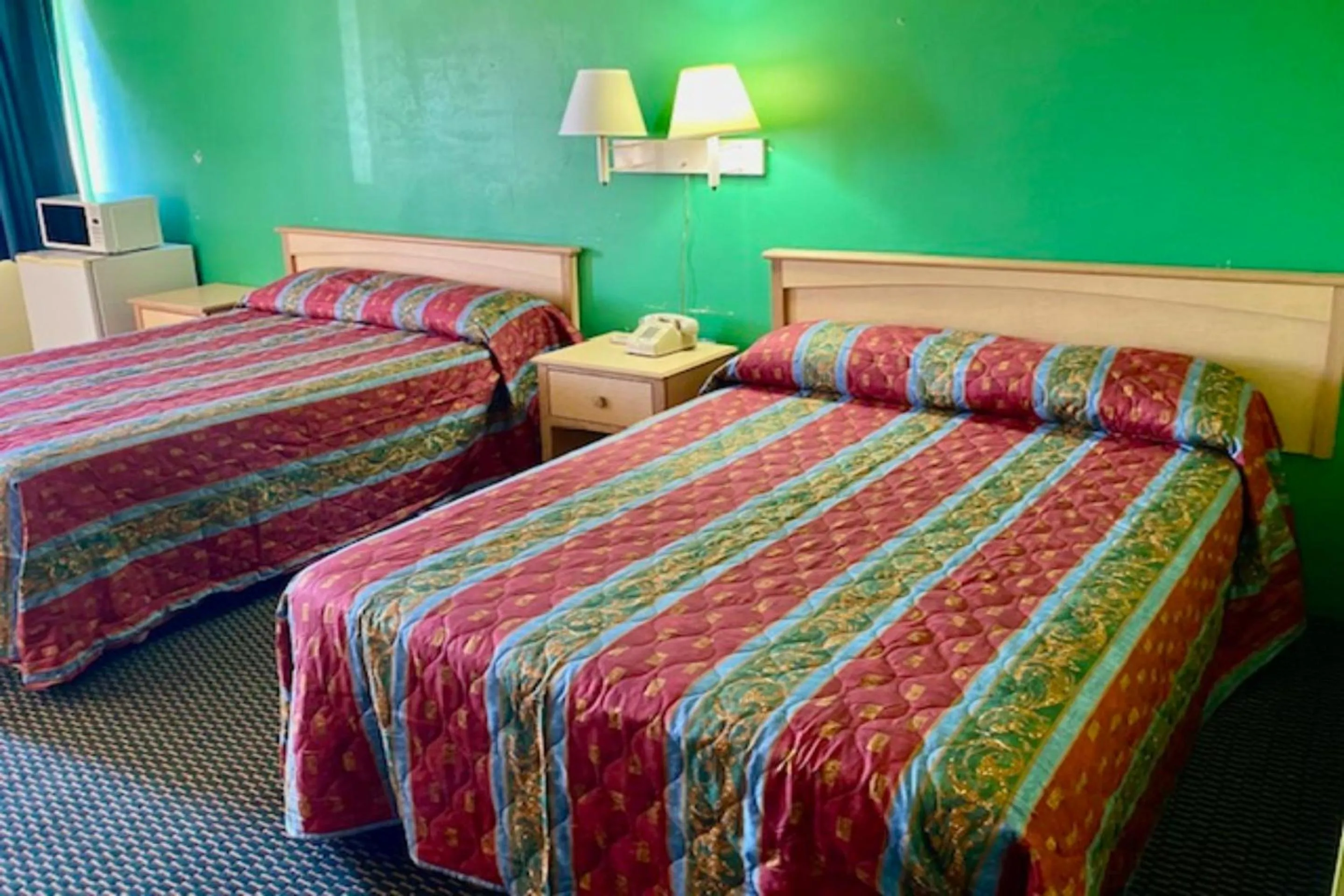 Bedroom, Bed in Red Carpet Inn & Suites Lima -Listing Partner