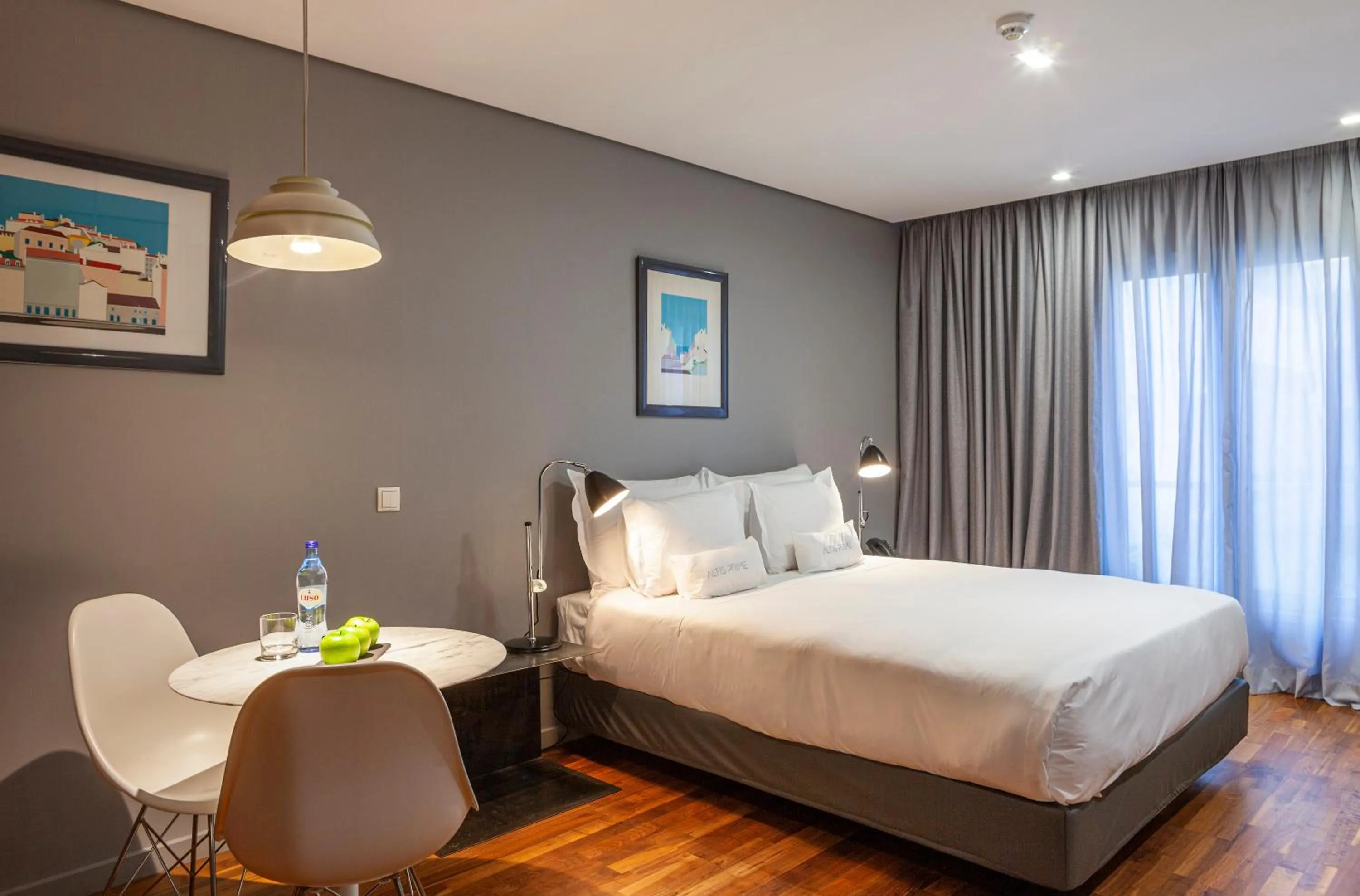 Seating area, Bed in Altis Prime Hotel