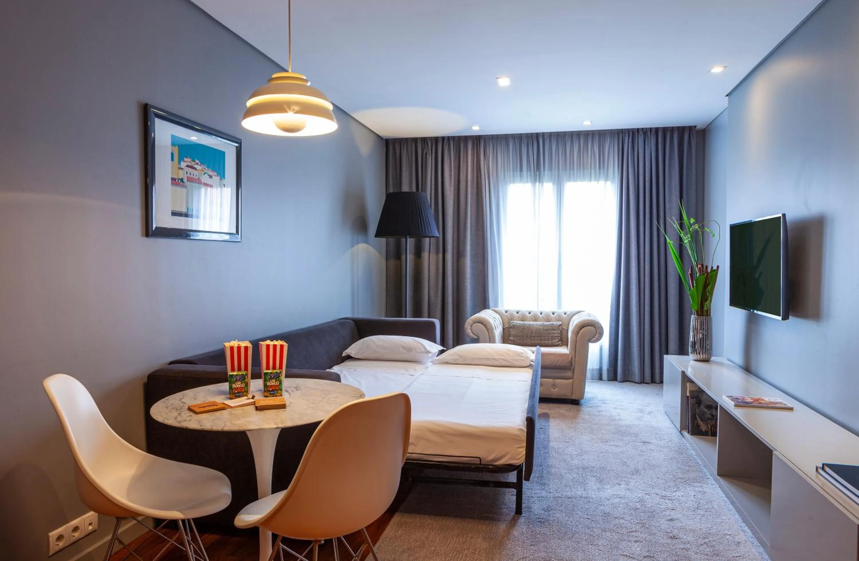 Living room, Bed in Altis Prime Hotel