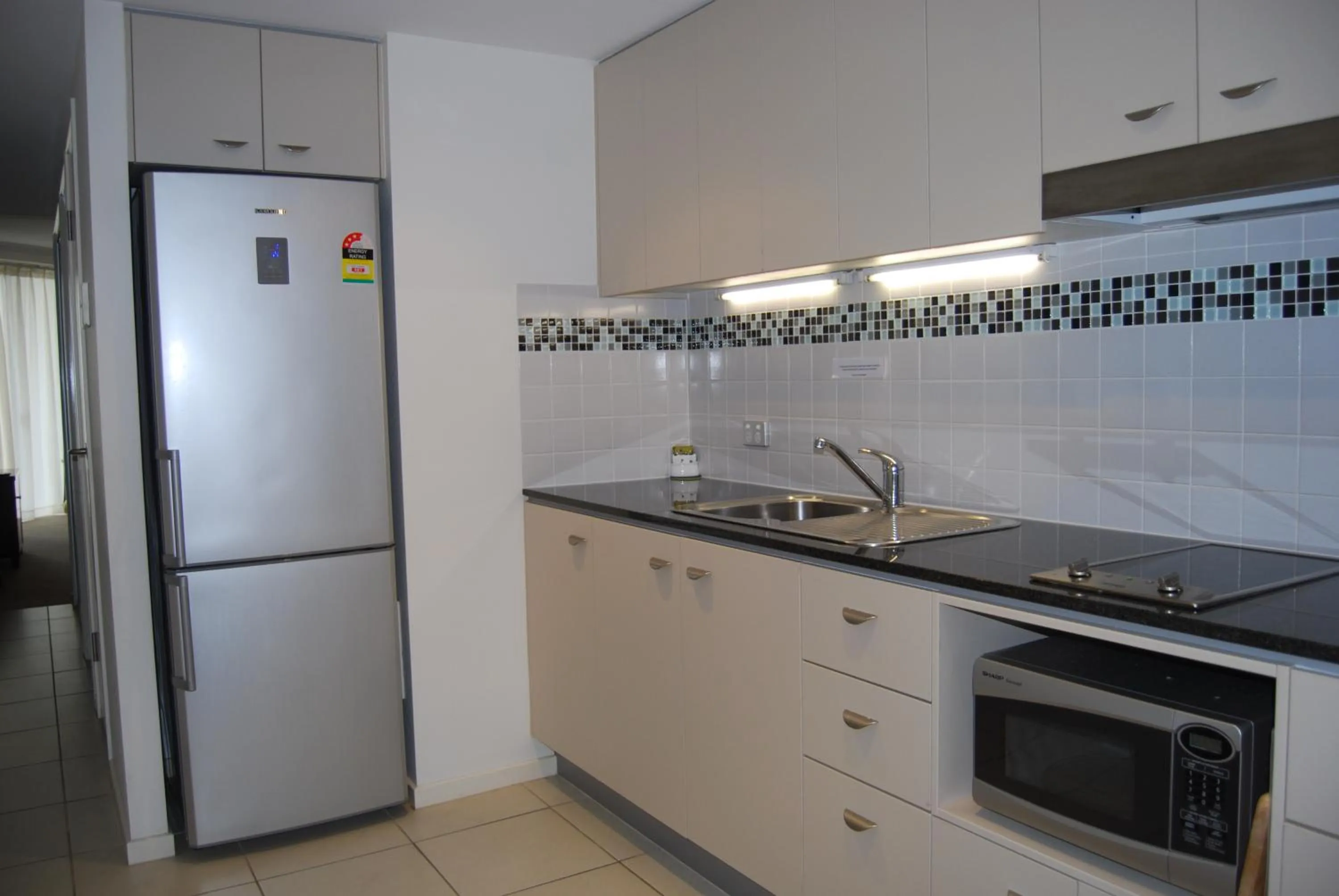 Kitchen or kitchenette in Ocean Views Resort Caloundra