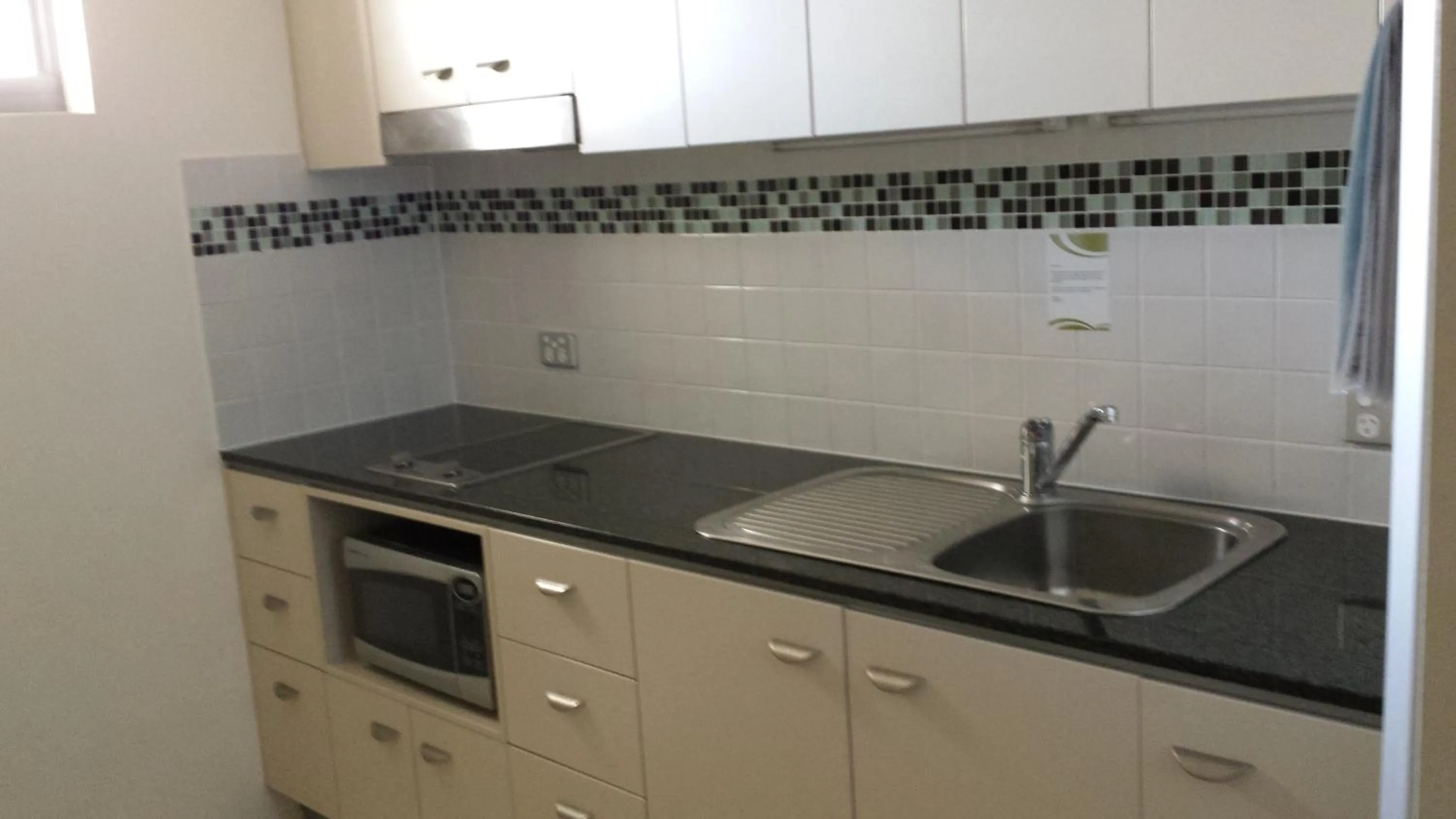 Kitchen or kitchenette in Ocean Views Resort Caloundra