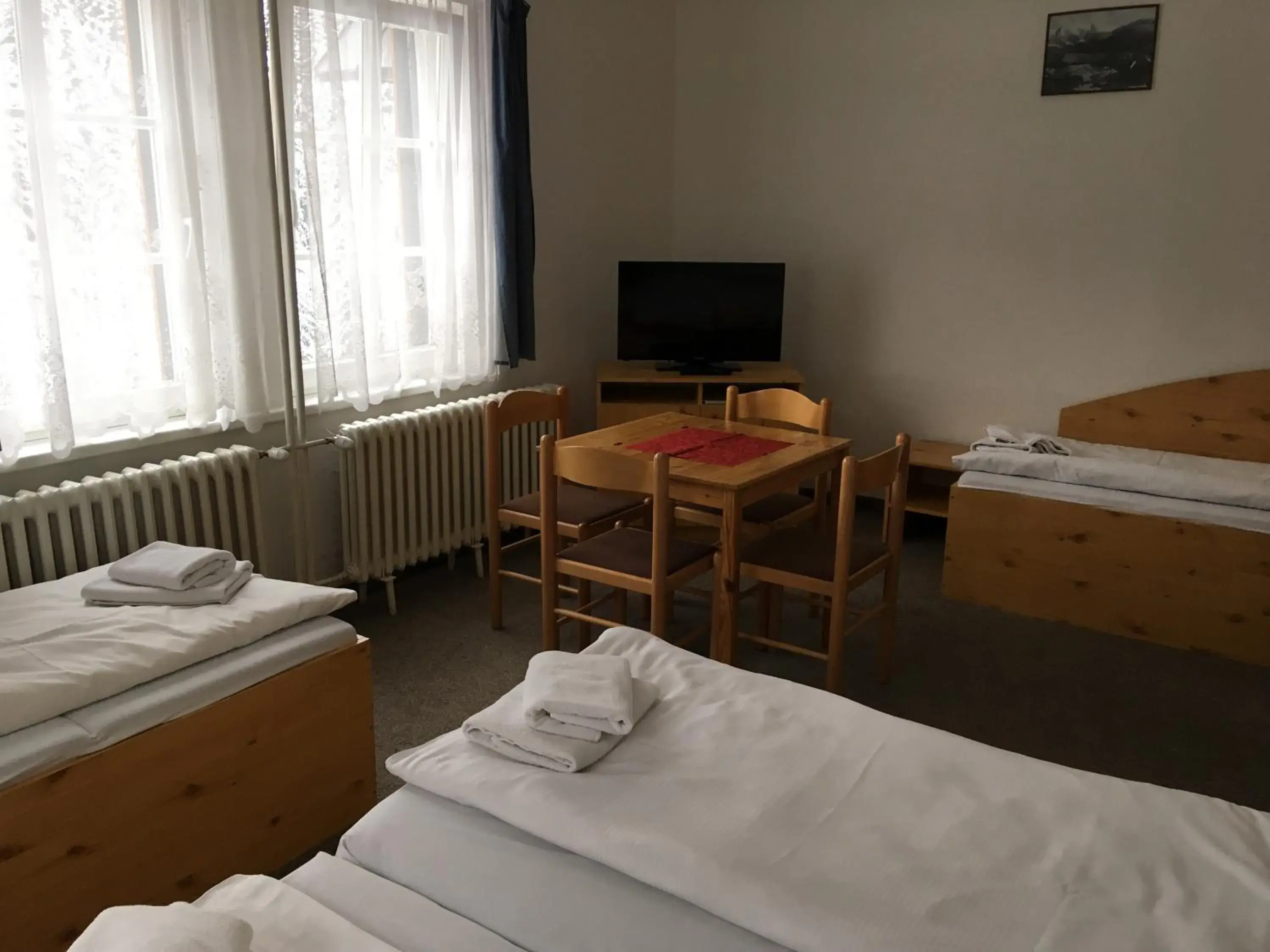 Quadruple Room in Hotel Tři Růže Quadruple Room in Hotel Tři Růže