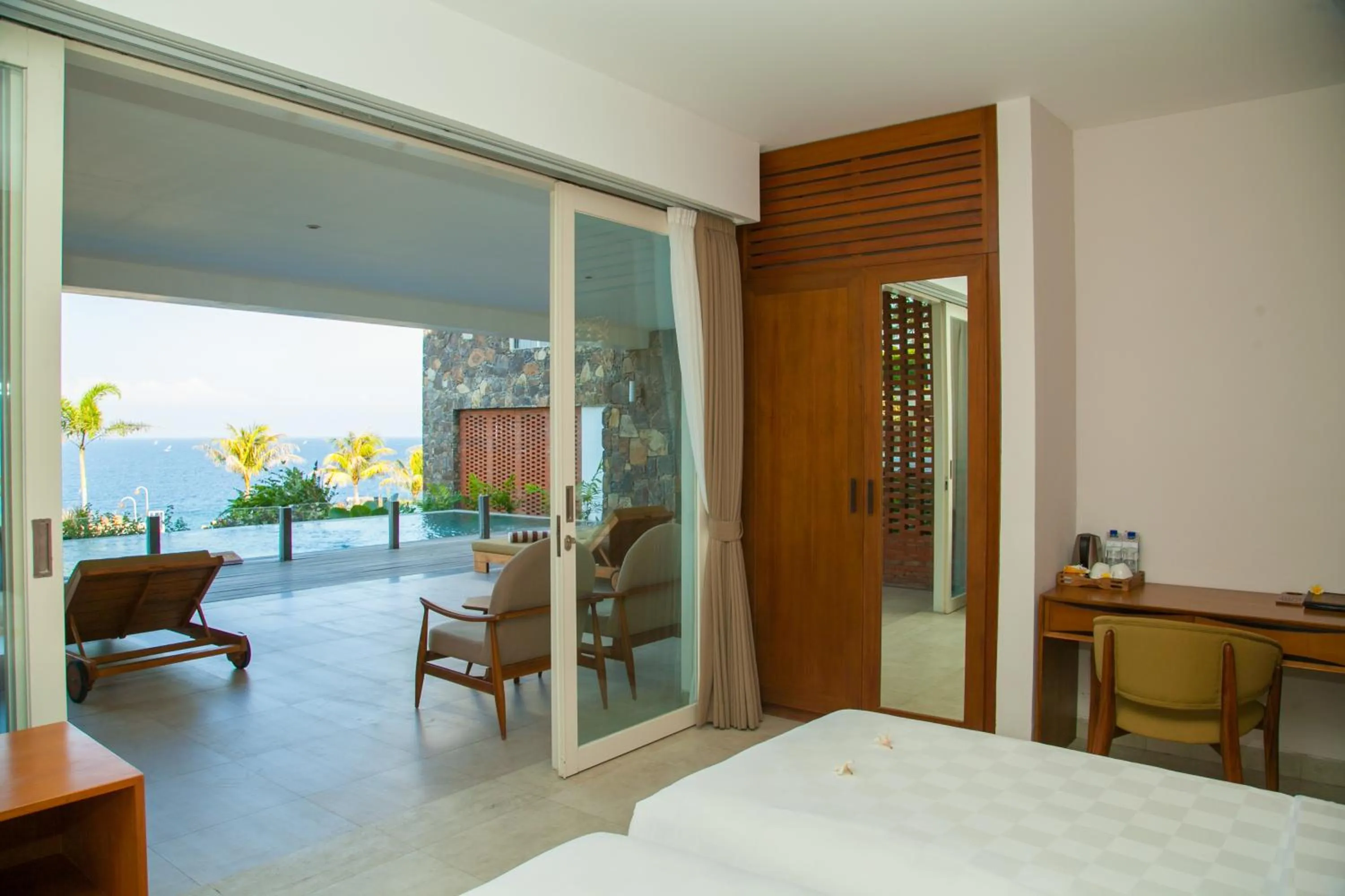 Balcony/Terrace, Bed in Rajavilla Lombok Resort - Seaside Serenity