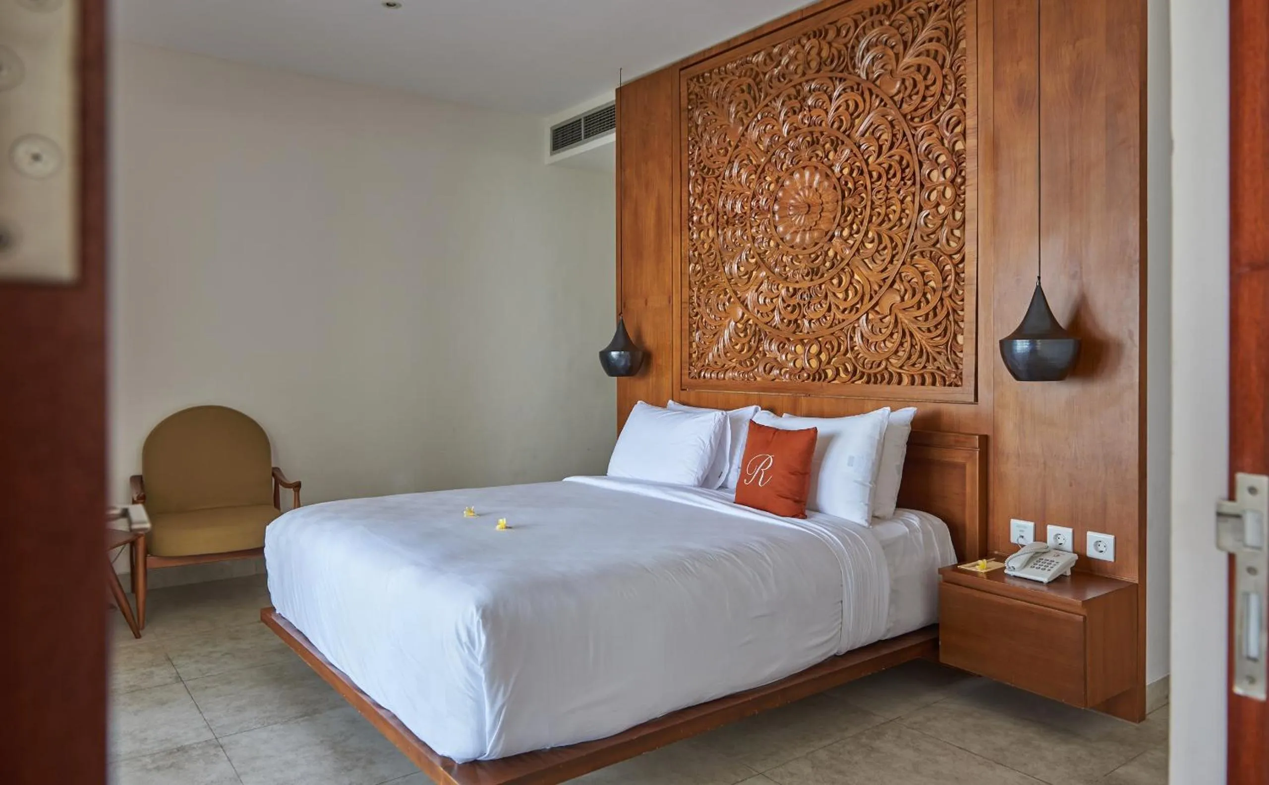 Bed in Rajavilla Lombok Resort - Seaside Serenity