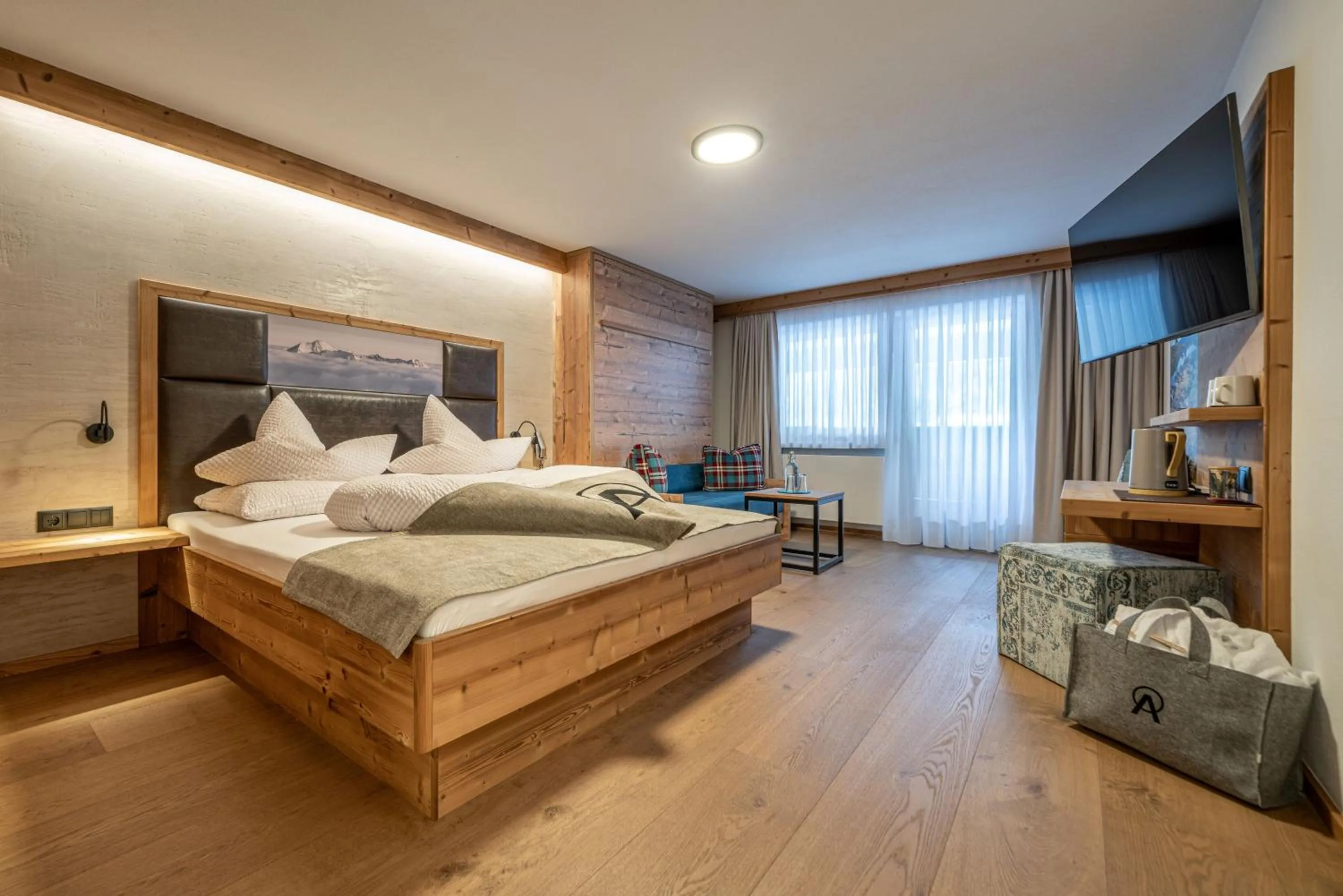 Photo of the whole room, Bed in Genusshotel Alpenblick