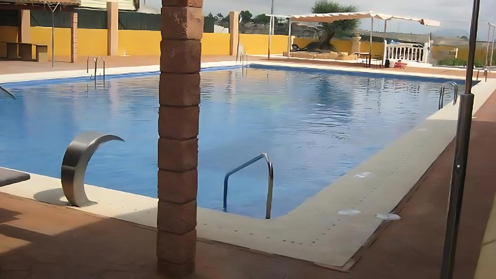 Swimming pool in Hospedium Hotel Los Periquitos