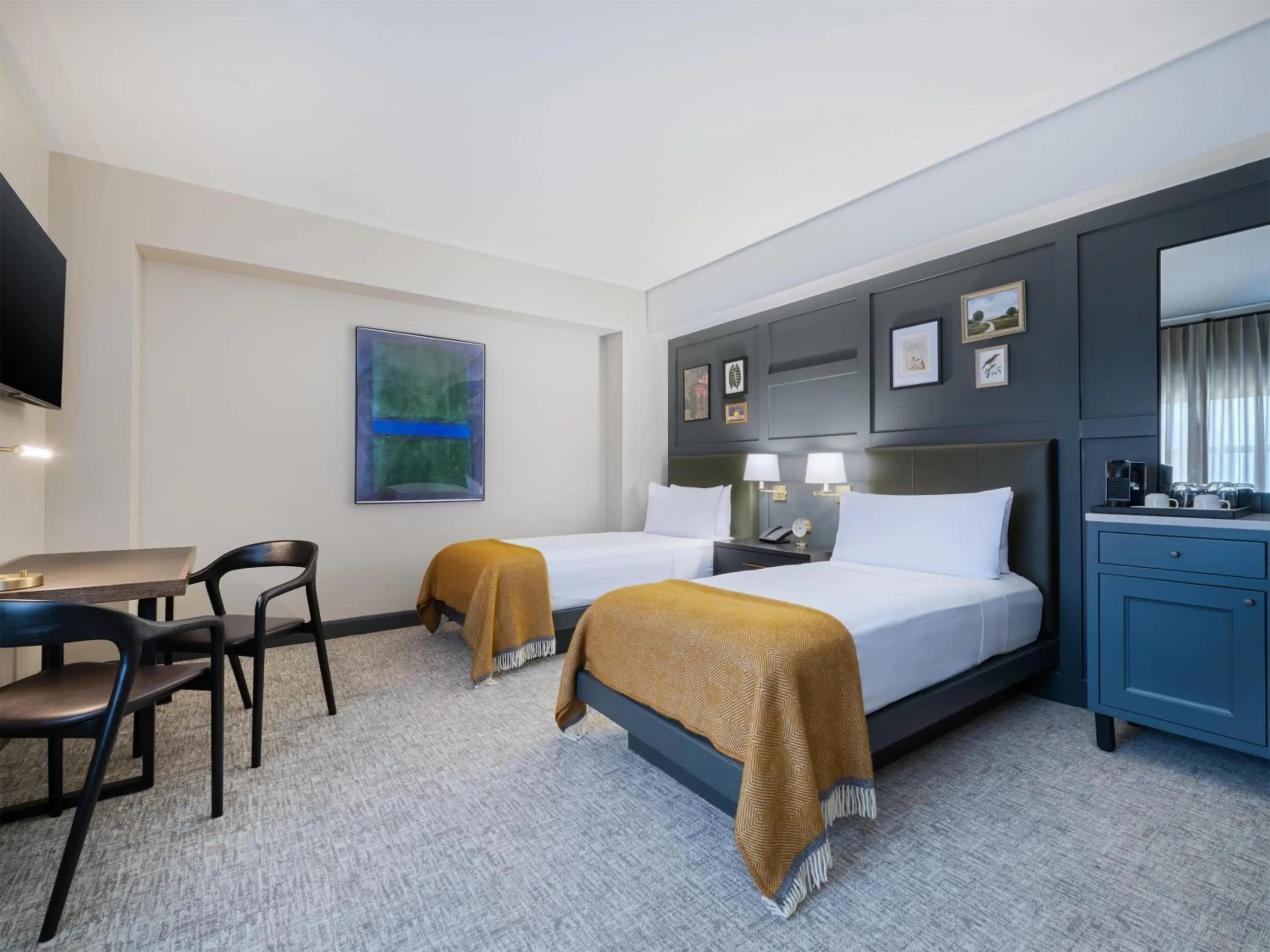 Bed in The Sam Houston Hotel, Curio Collection by Hilton