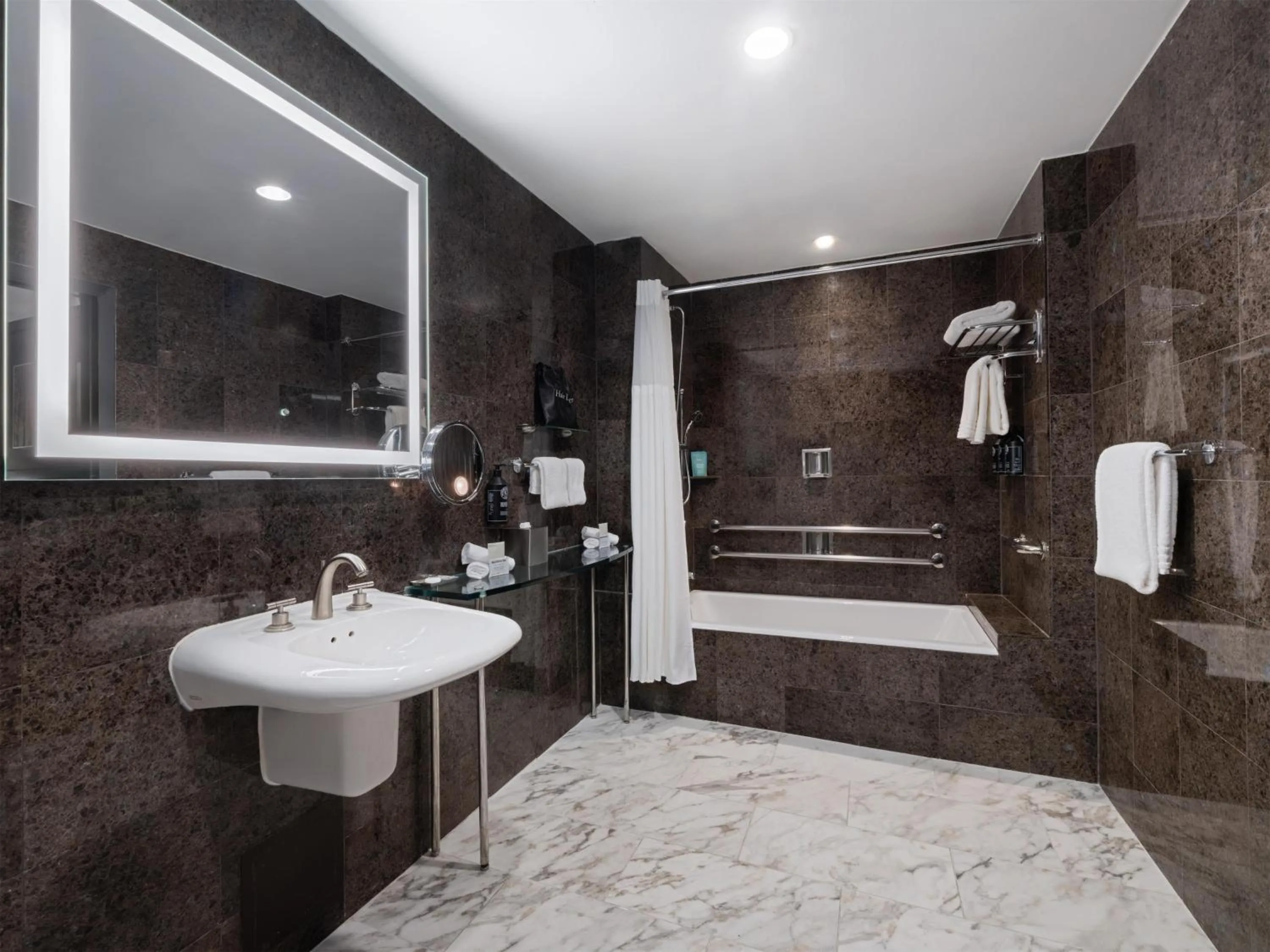 Shower in The Sam Houston Hotel, Curio Collection by Hilton